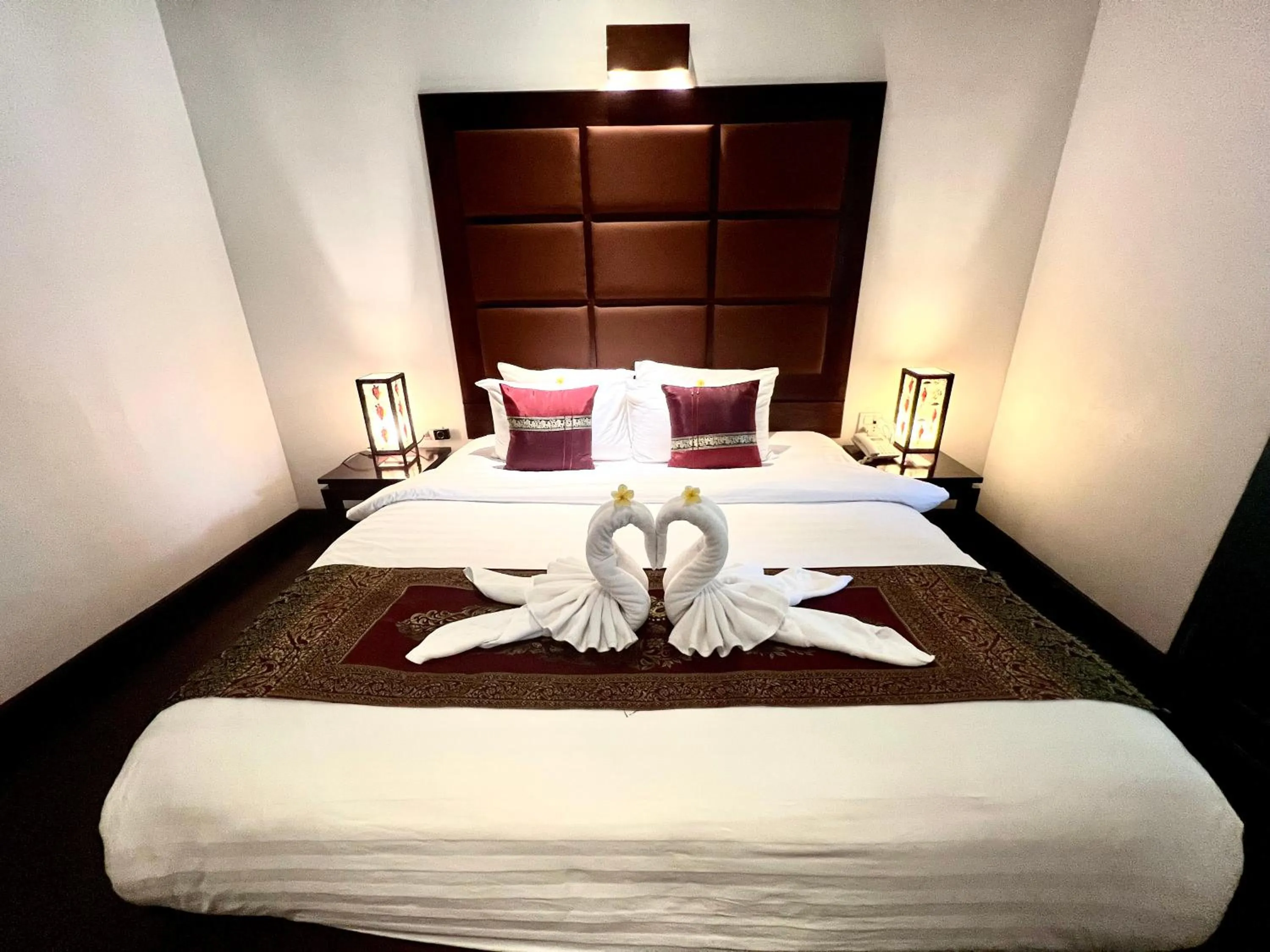 Bed in Meuangluang Hotel