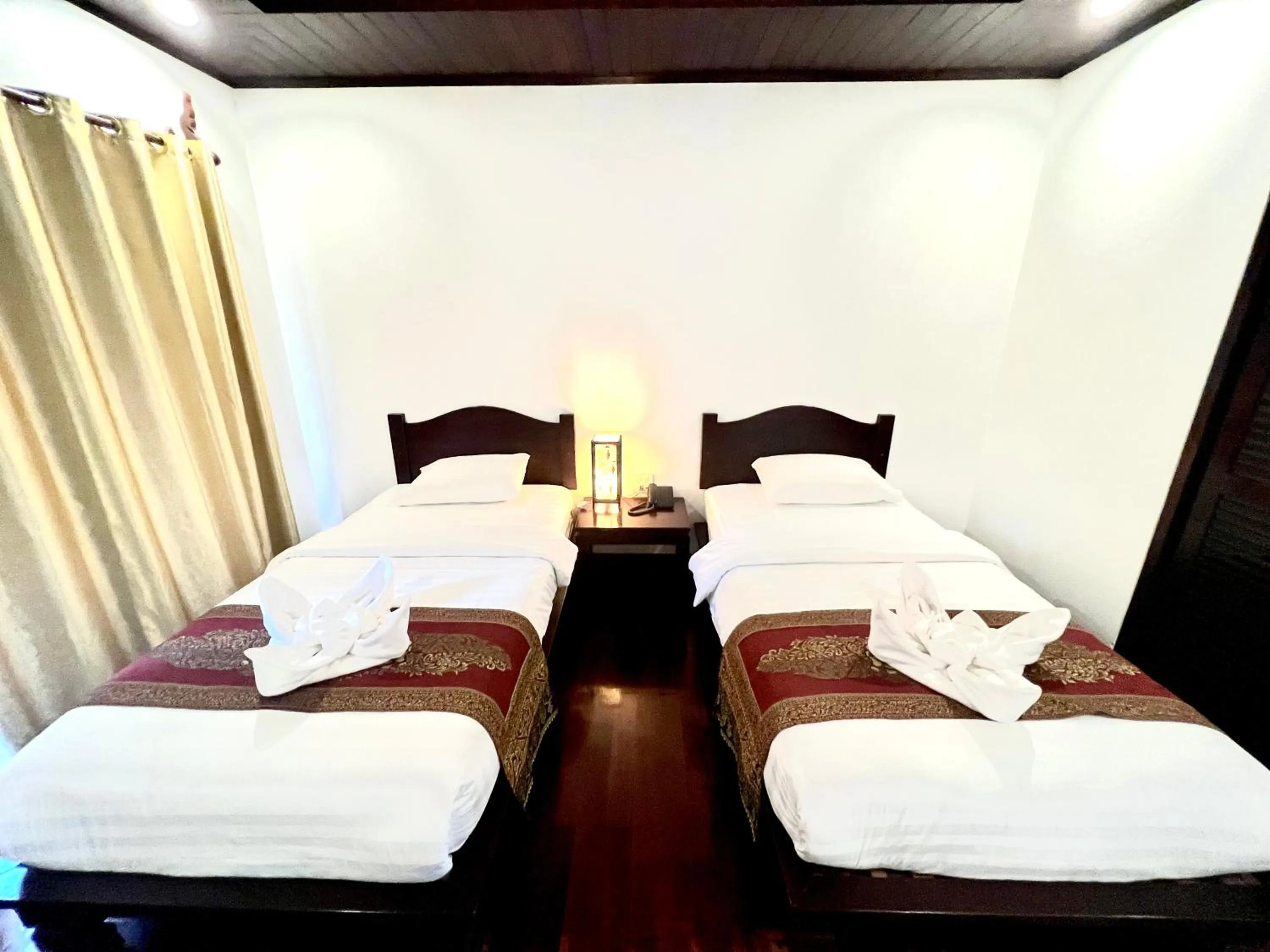 Bed in Meuangluang Hotel