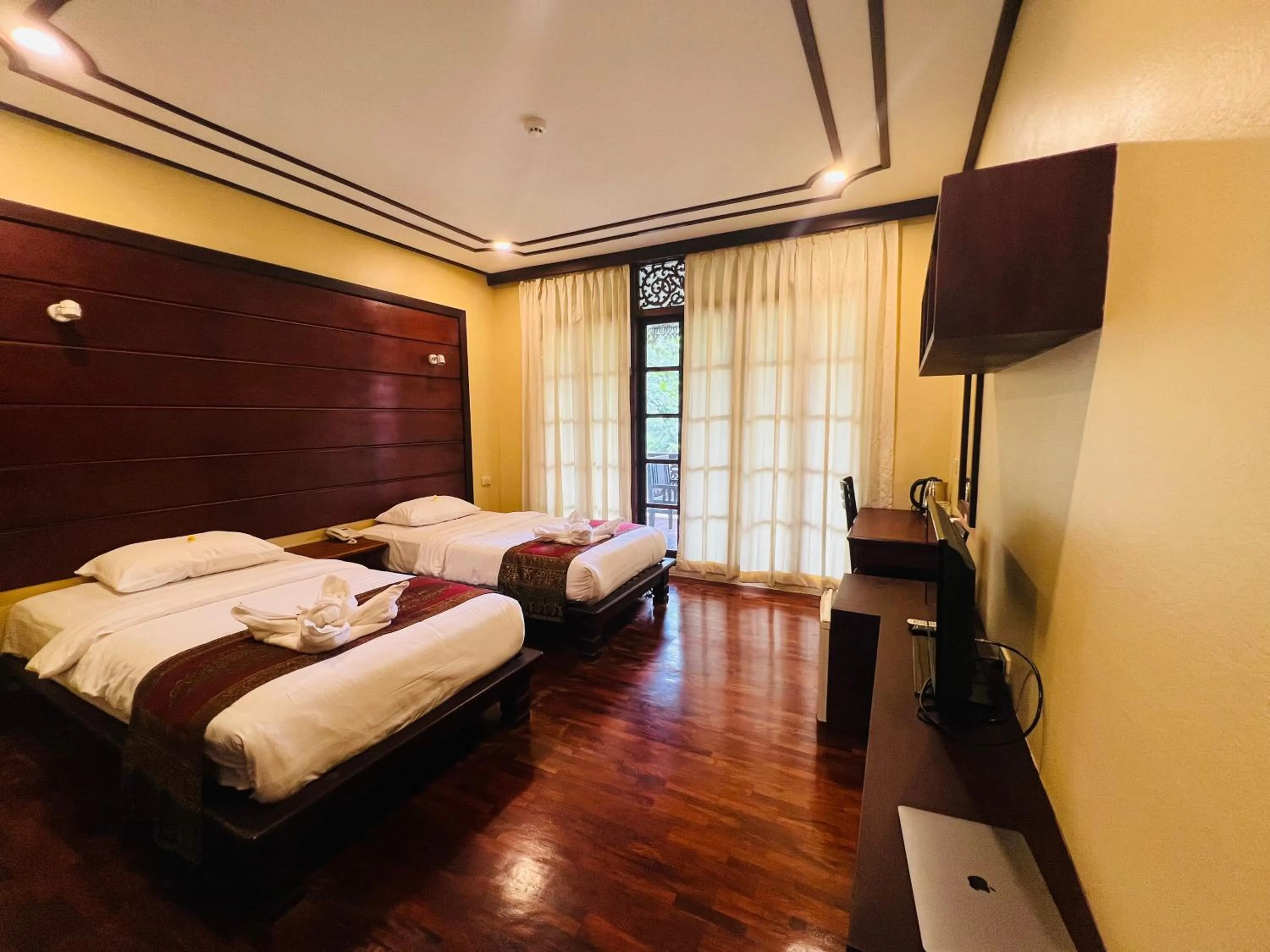 Bed in Meuangluang Hotel