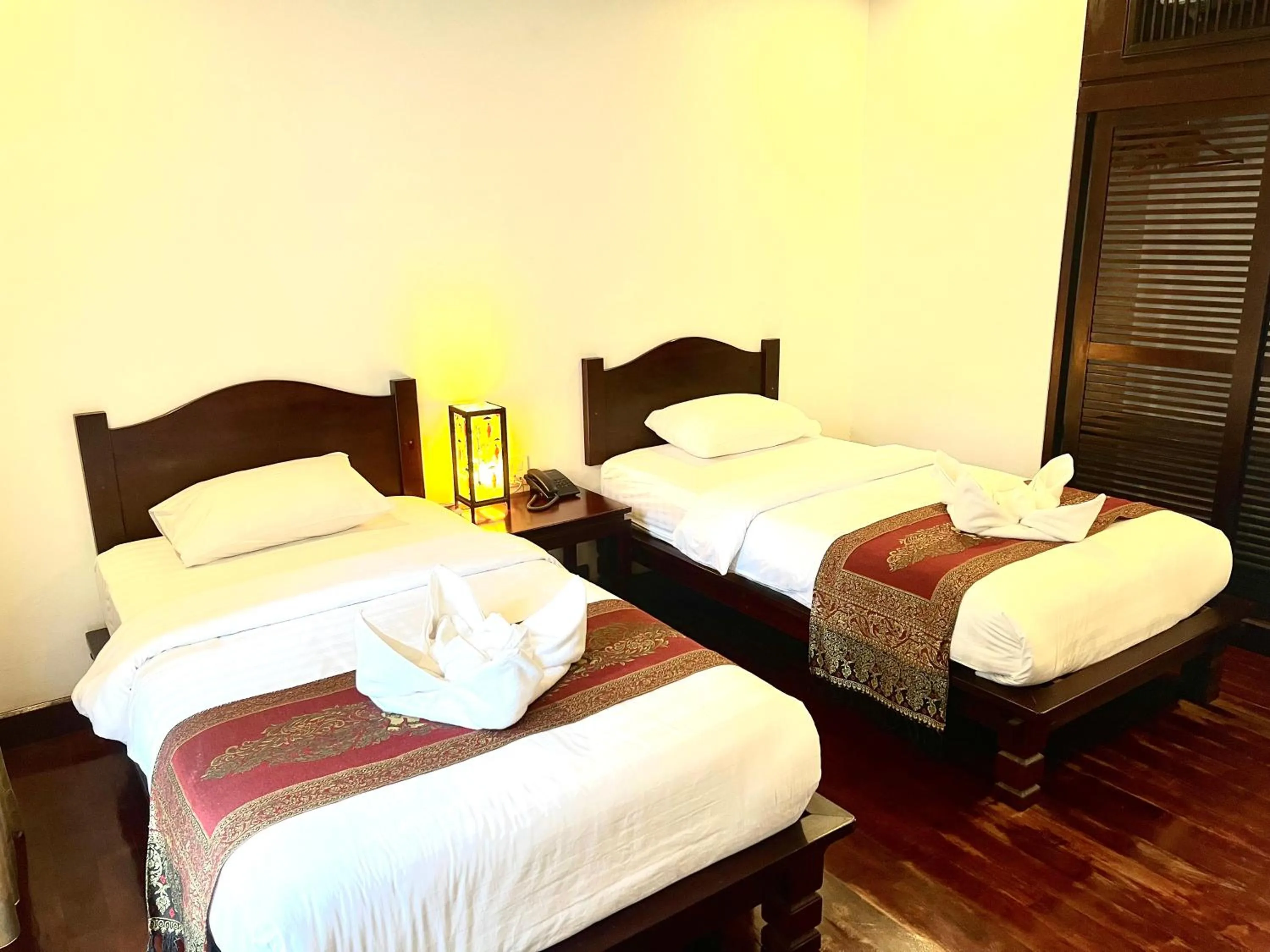 Bed in Meuangluang Hotel