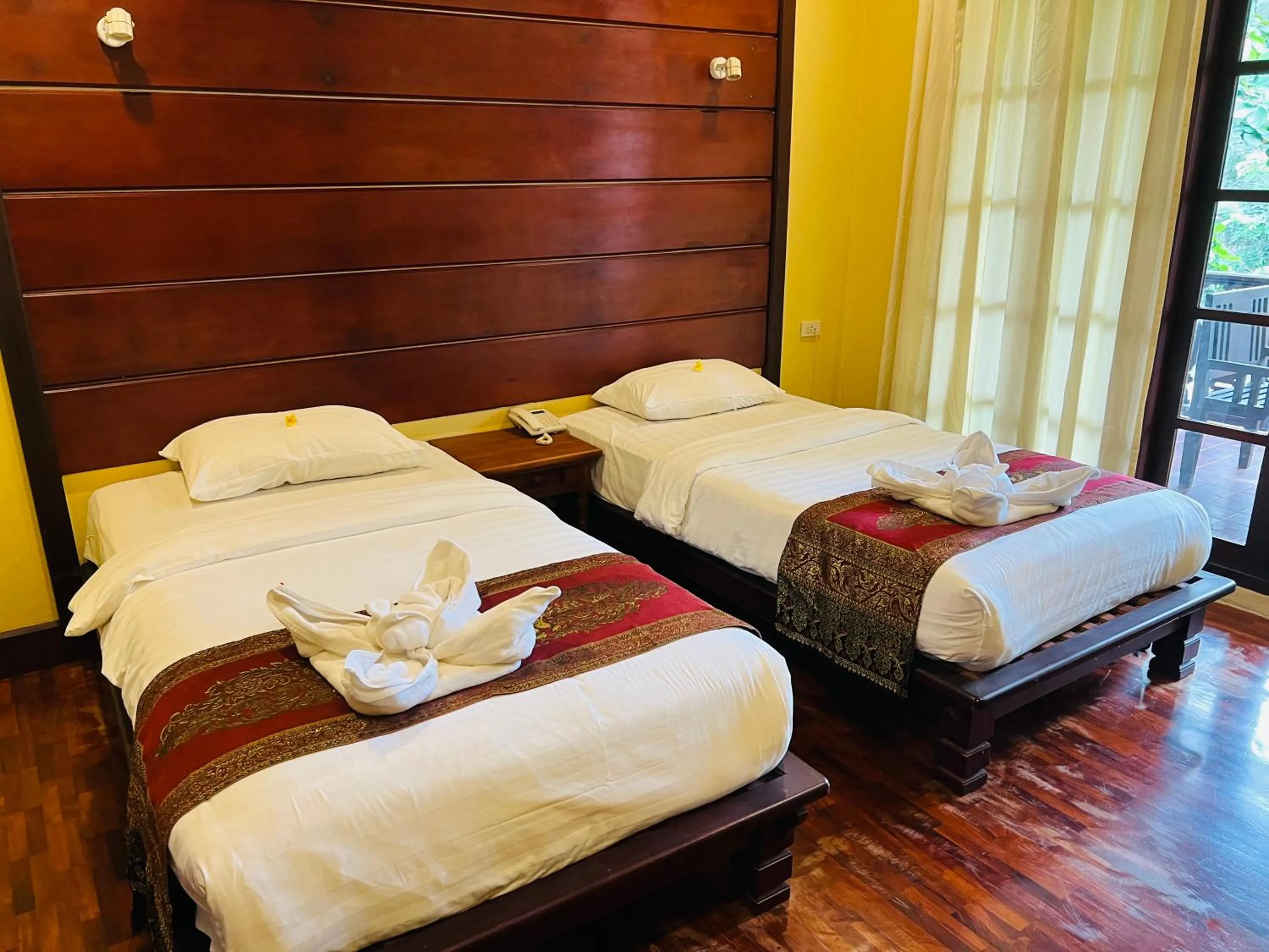Bed in Meuangluang Hotel