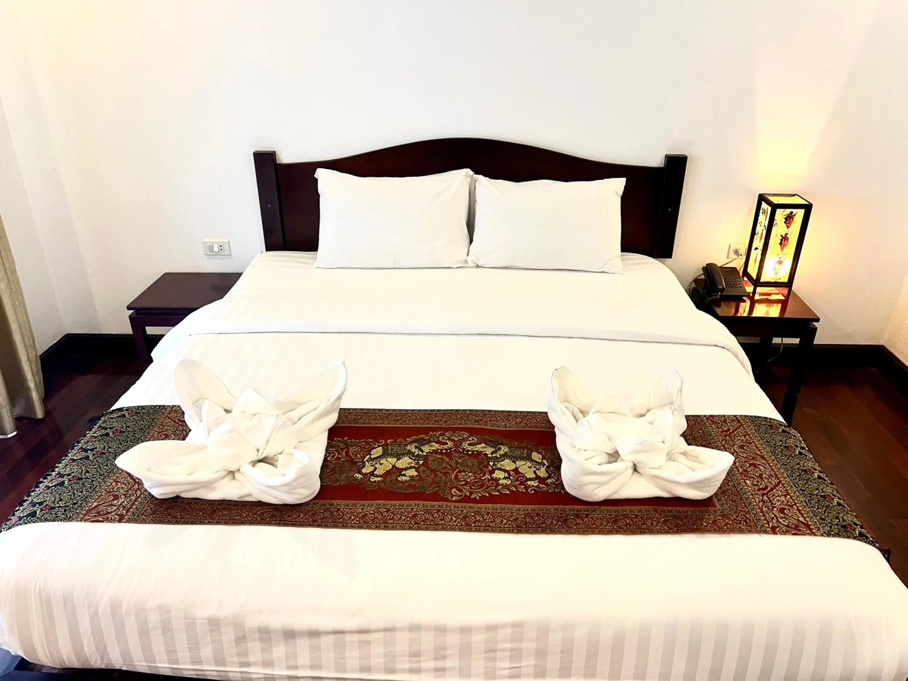 Bed in Meuangluang Hotel