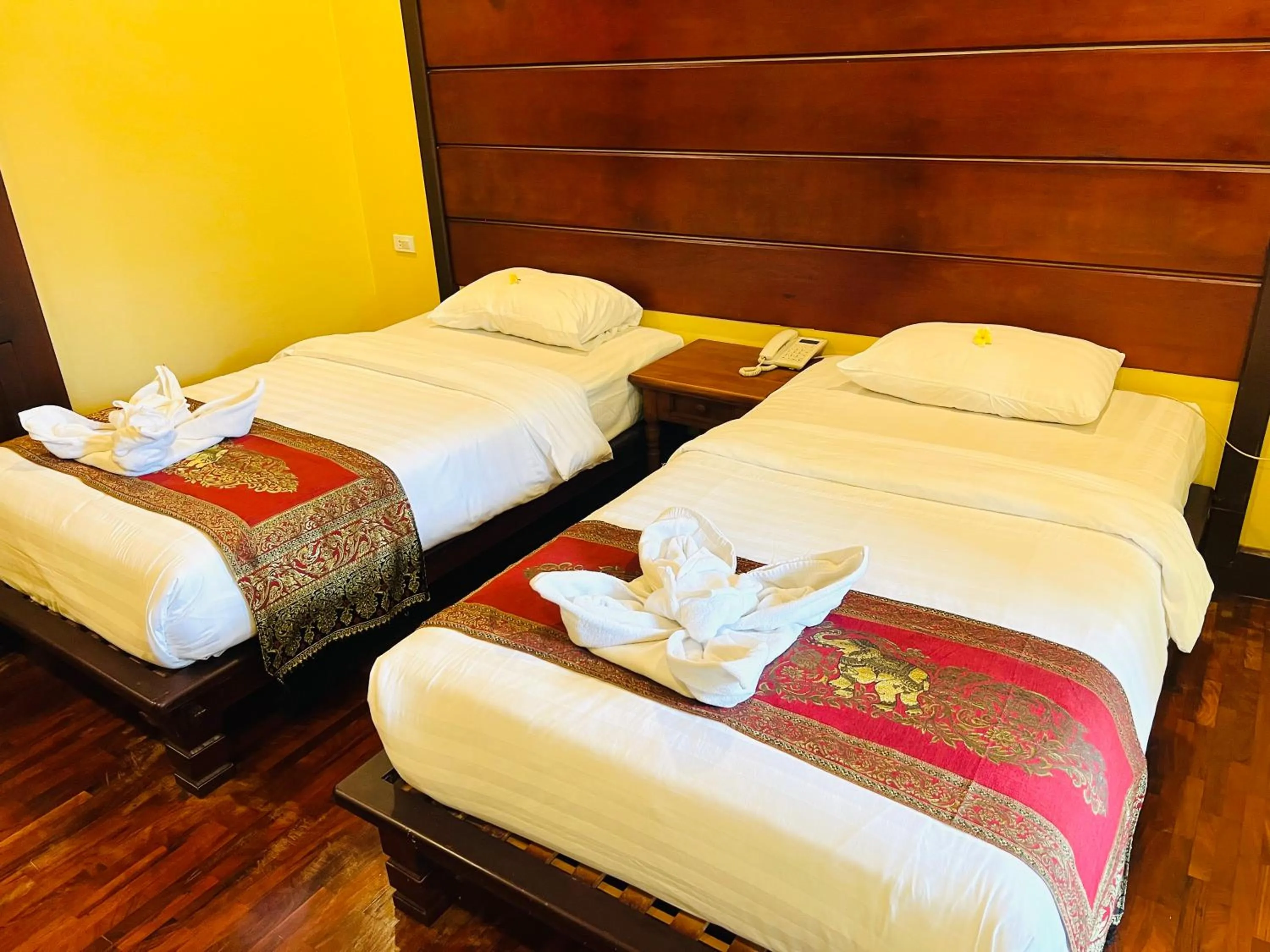 Bed in Meuangluang Hotel