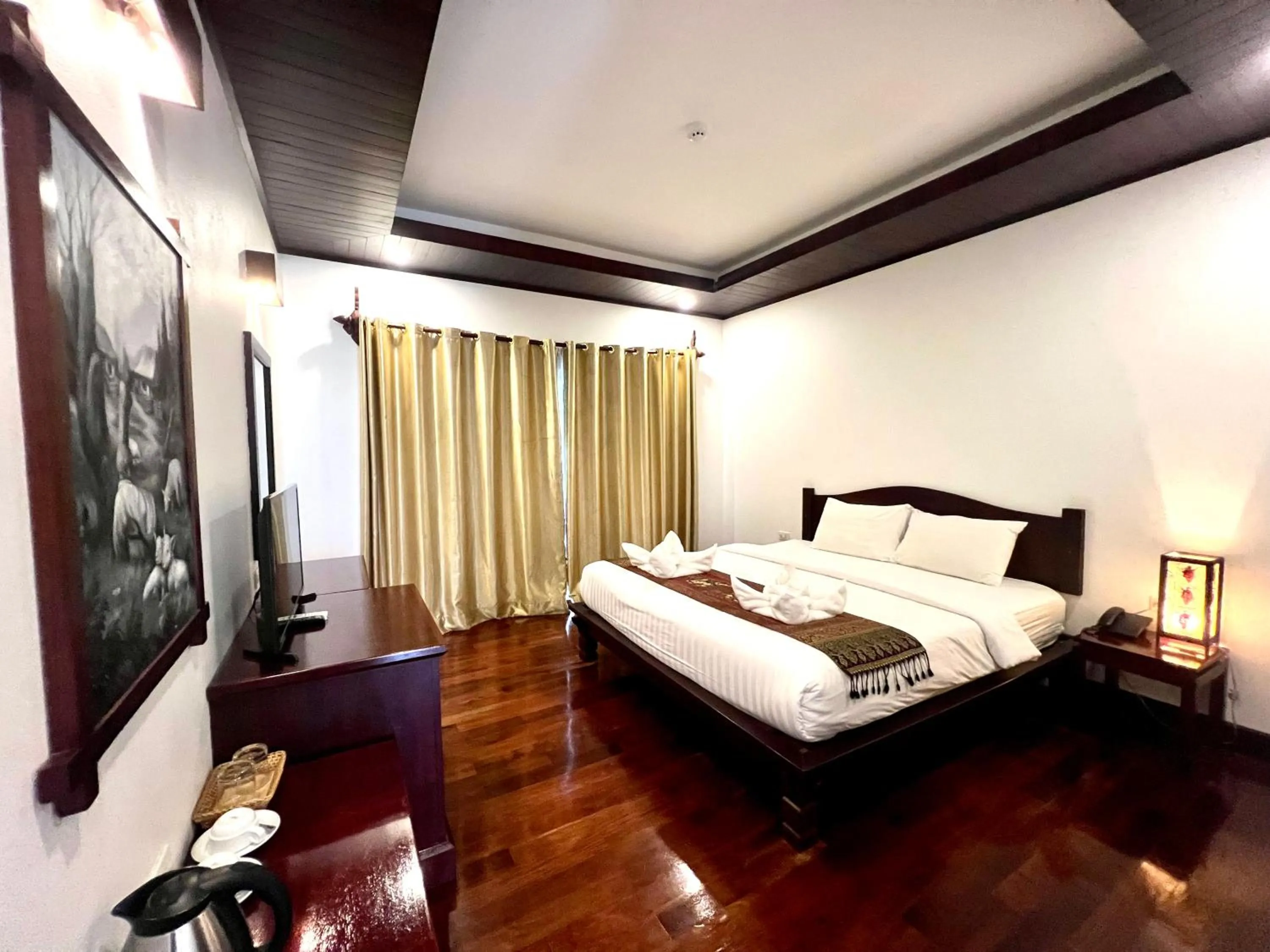 Bed in Meuangluang Hotel