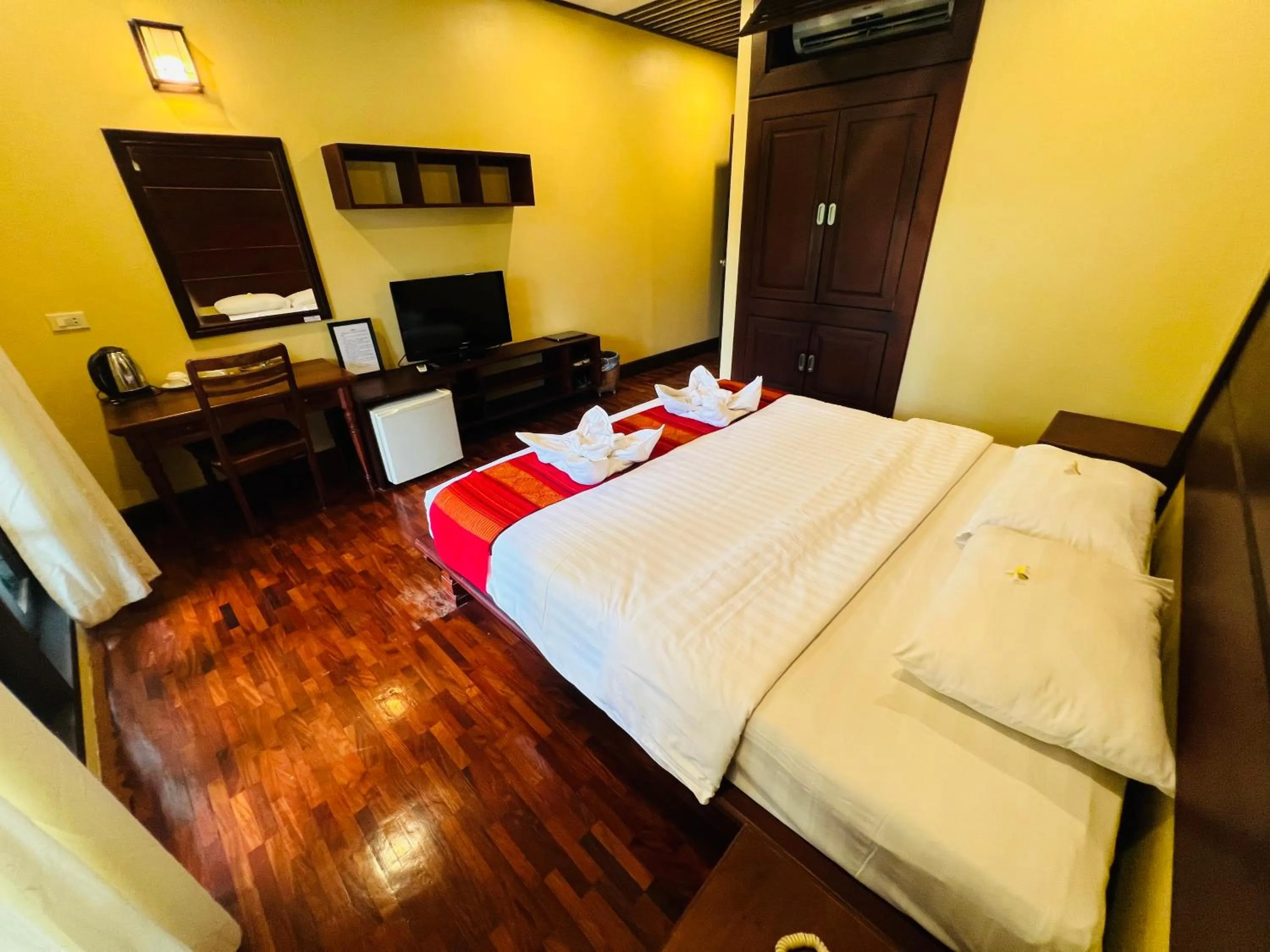 Bed in Meuangluang Hotel