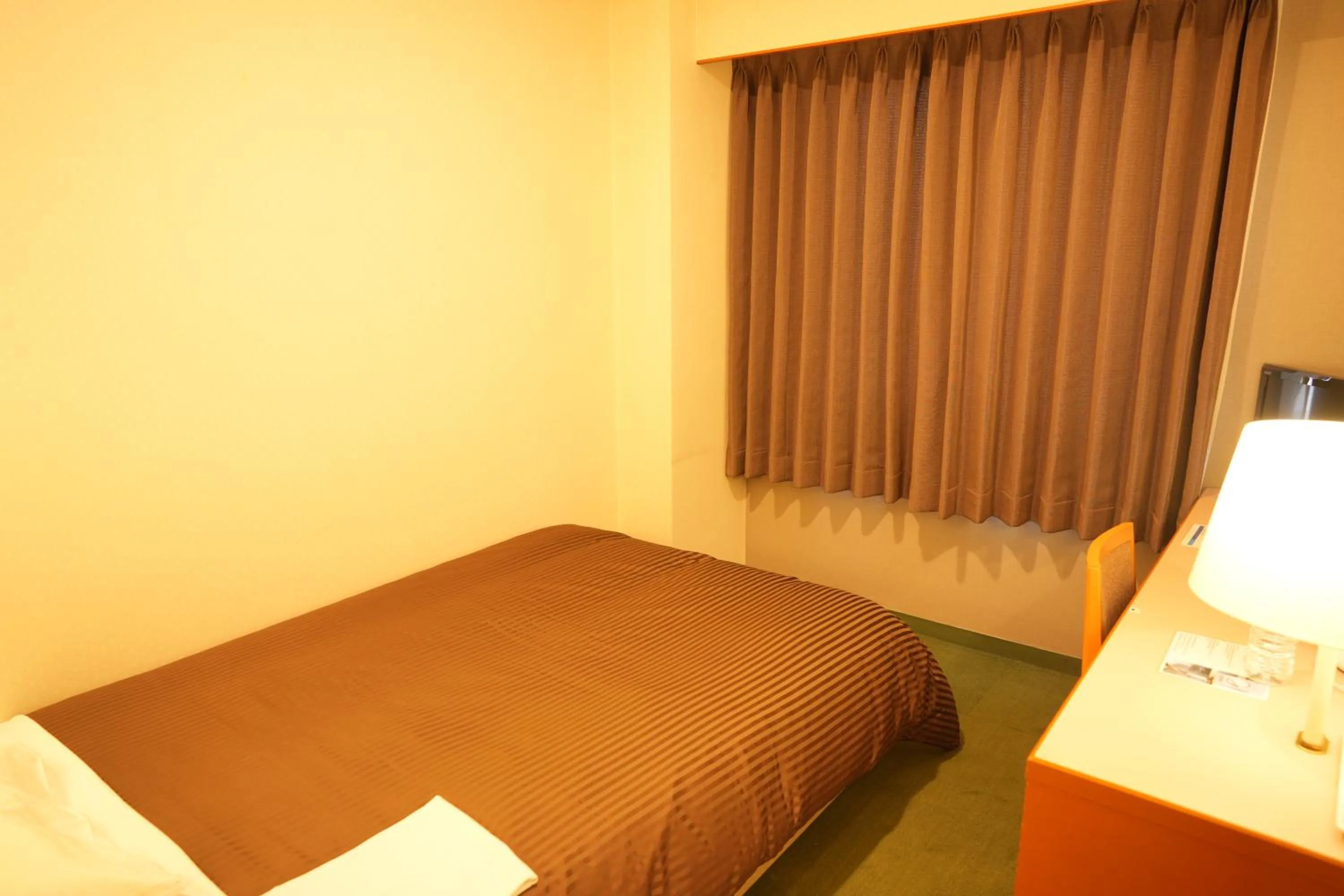 Bed in Matsuzaka Frex Hotel