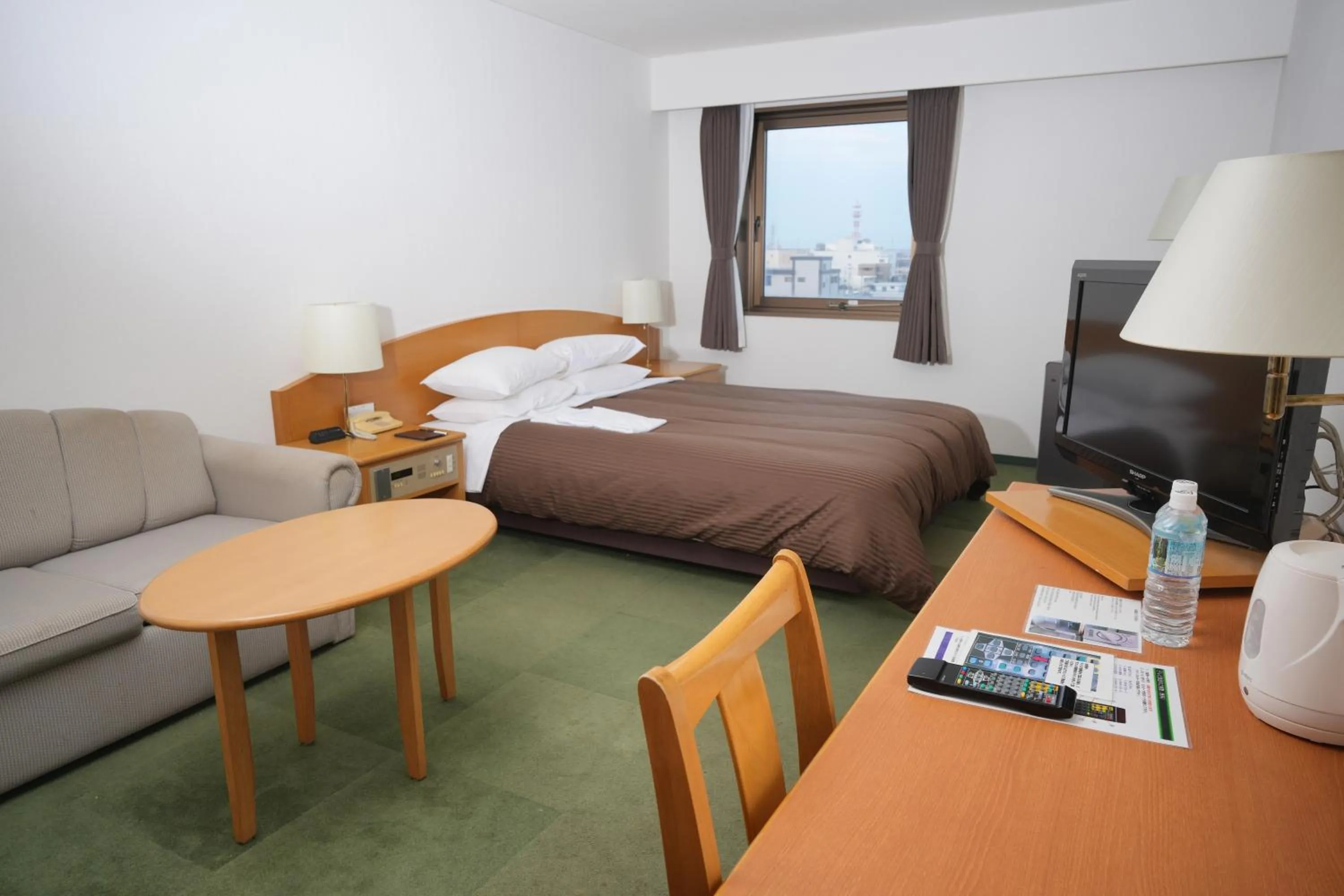 Bed in Matsuzaka Frex Hotel