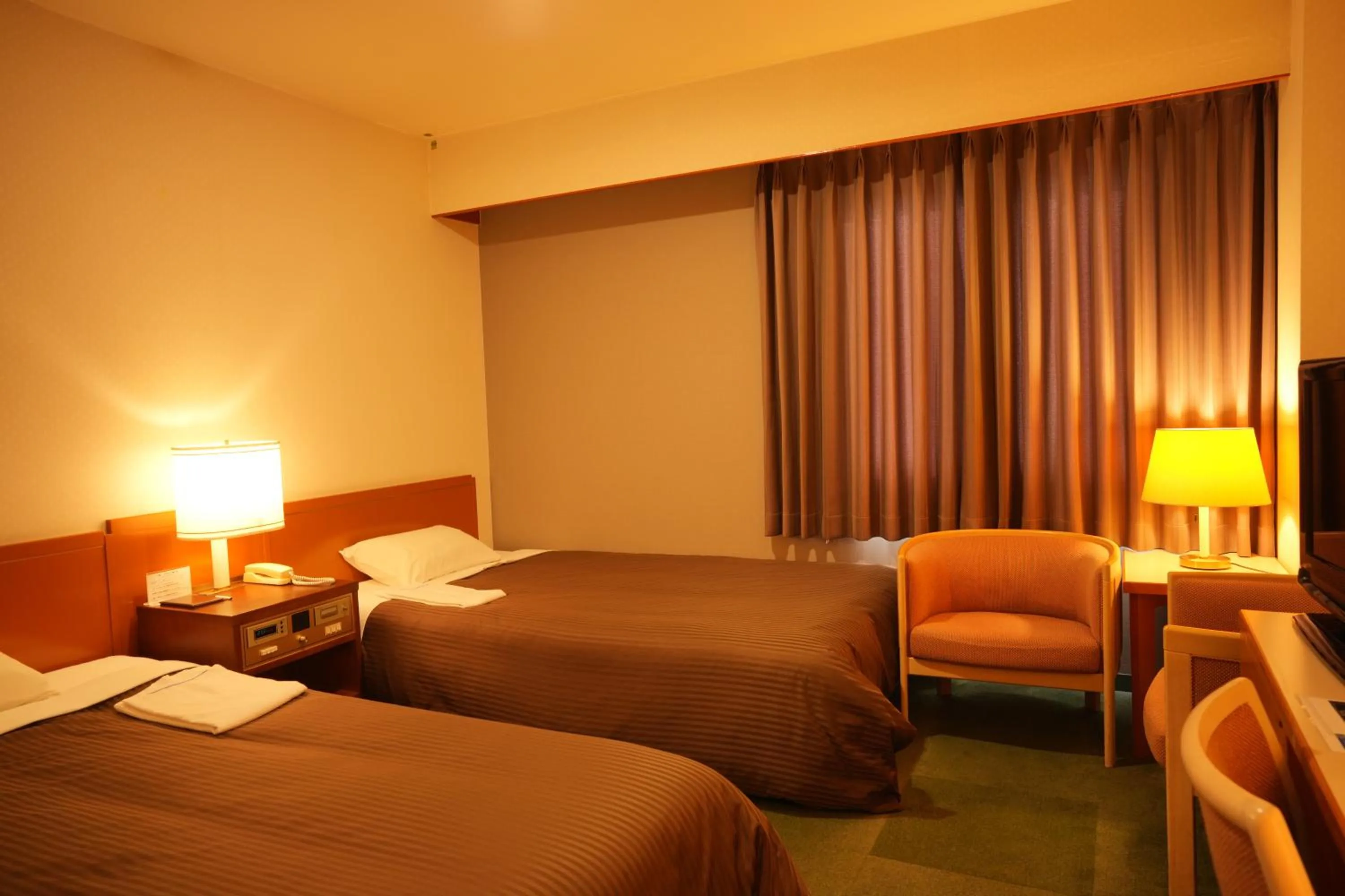 Bed in Matsuzaka Frex Hotel