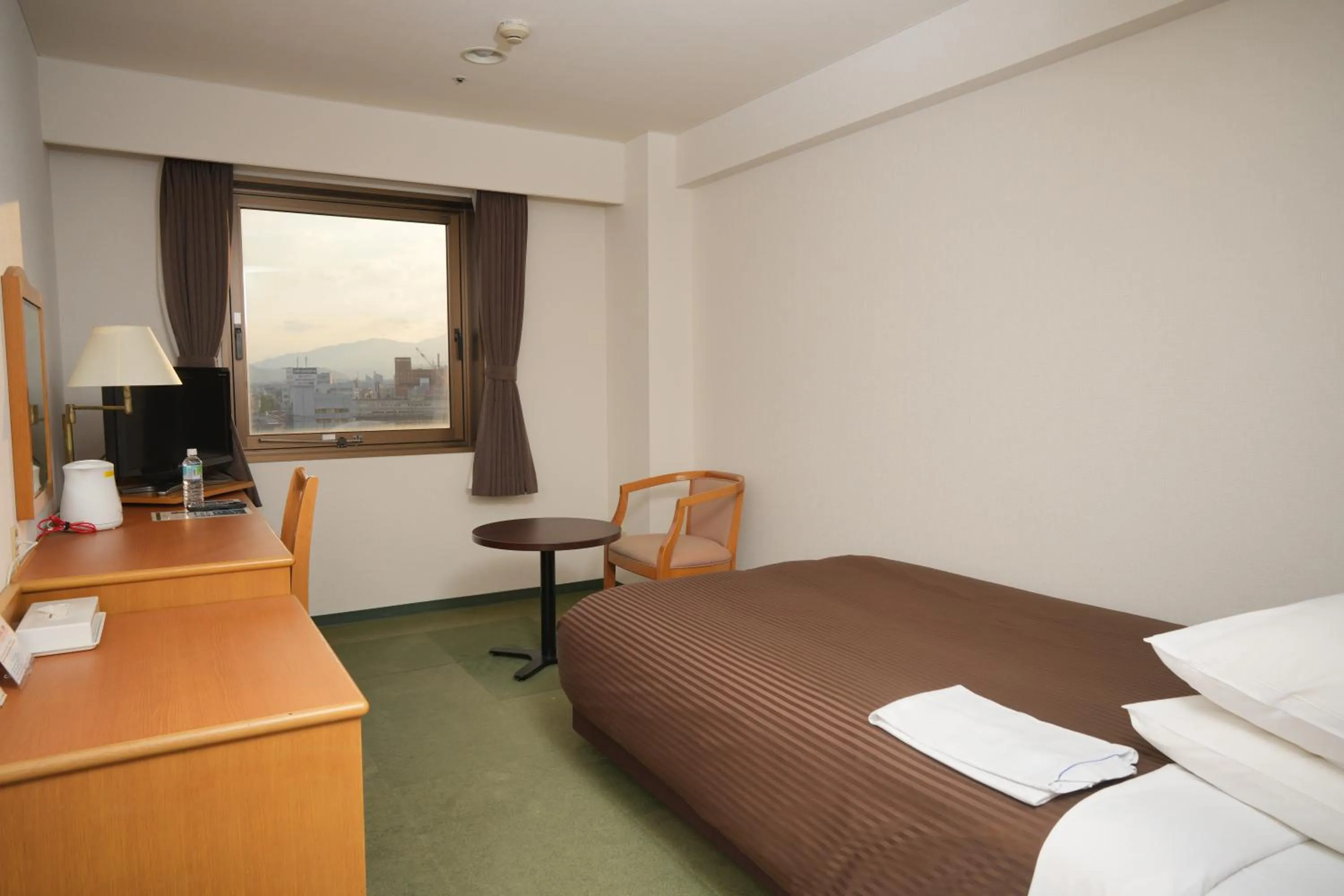 Bed in Matsuzaka Frex Hotel