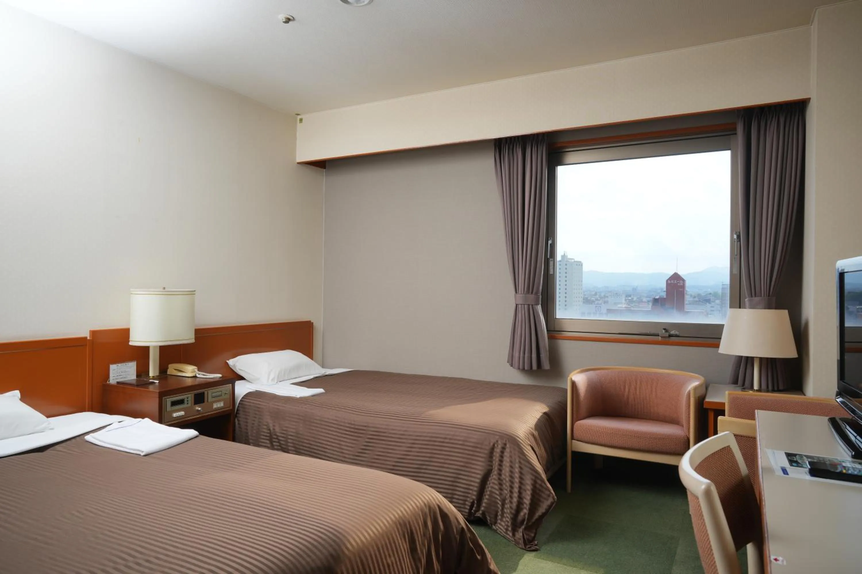 Bed in Matsuzaka Frex Hotel