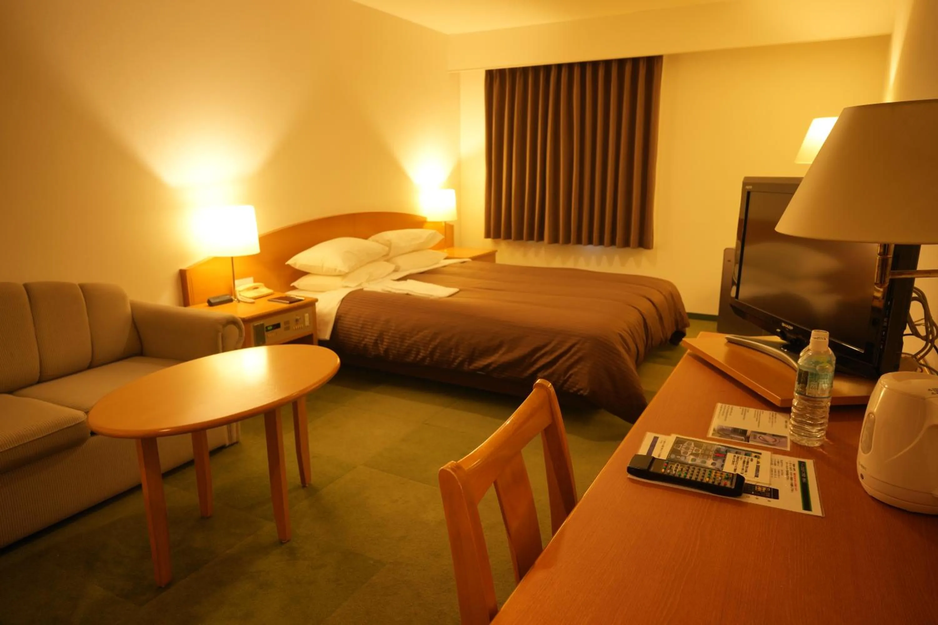 Bed in Matsuzaka Frex Hotel
