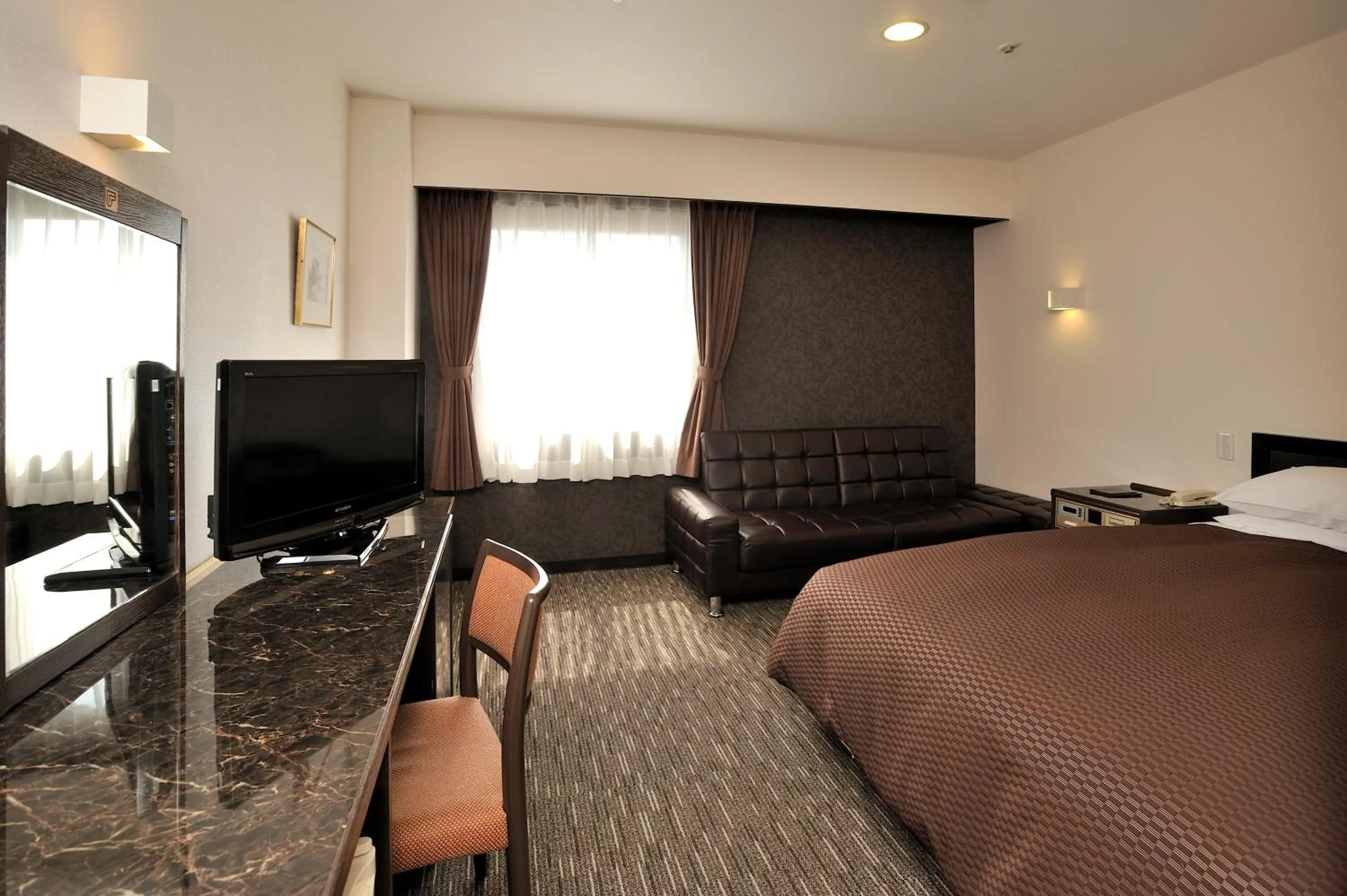 Bed in Matsuzaka Frex Hotel