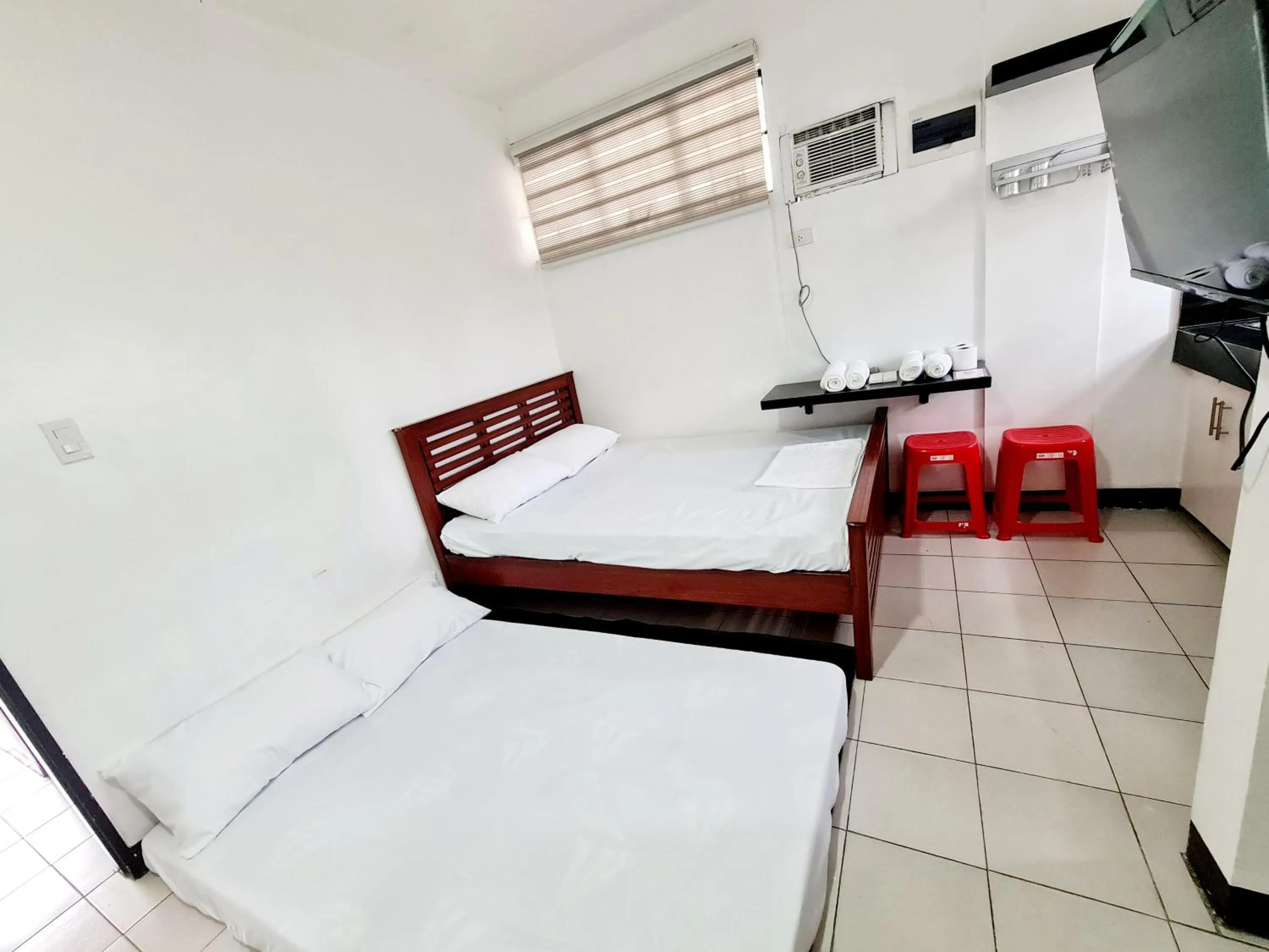 TV and multimedia, Bed in Dasma Lofts Hotel near Dela Salle Dasma