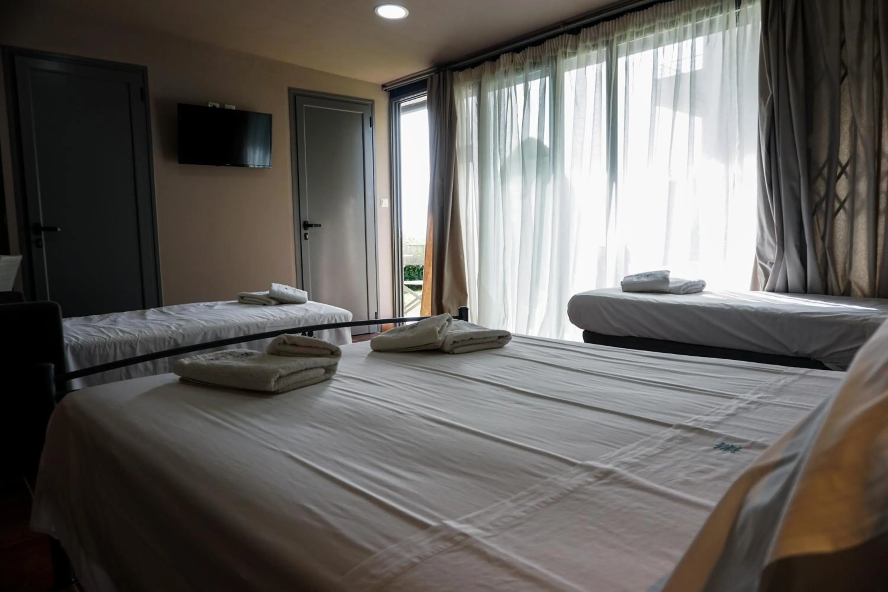 Bed in Marini Luxury Apartments and Suites