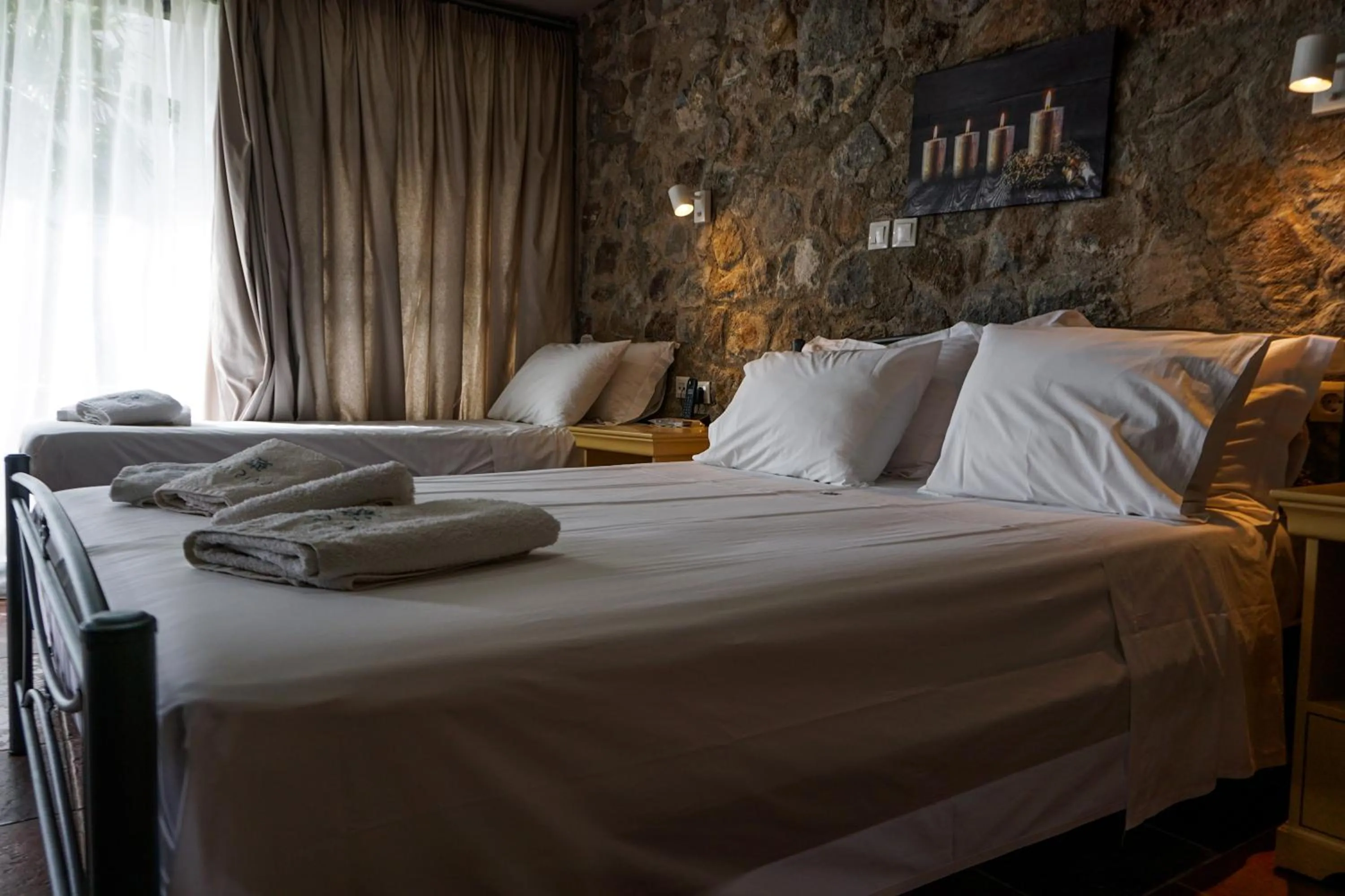 Bed in Marini Luxury Apartments and Suites