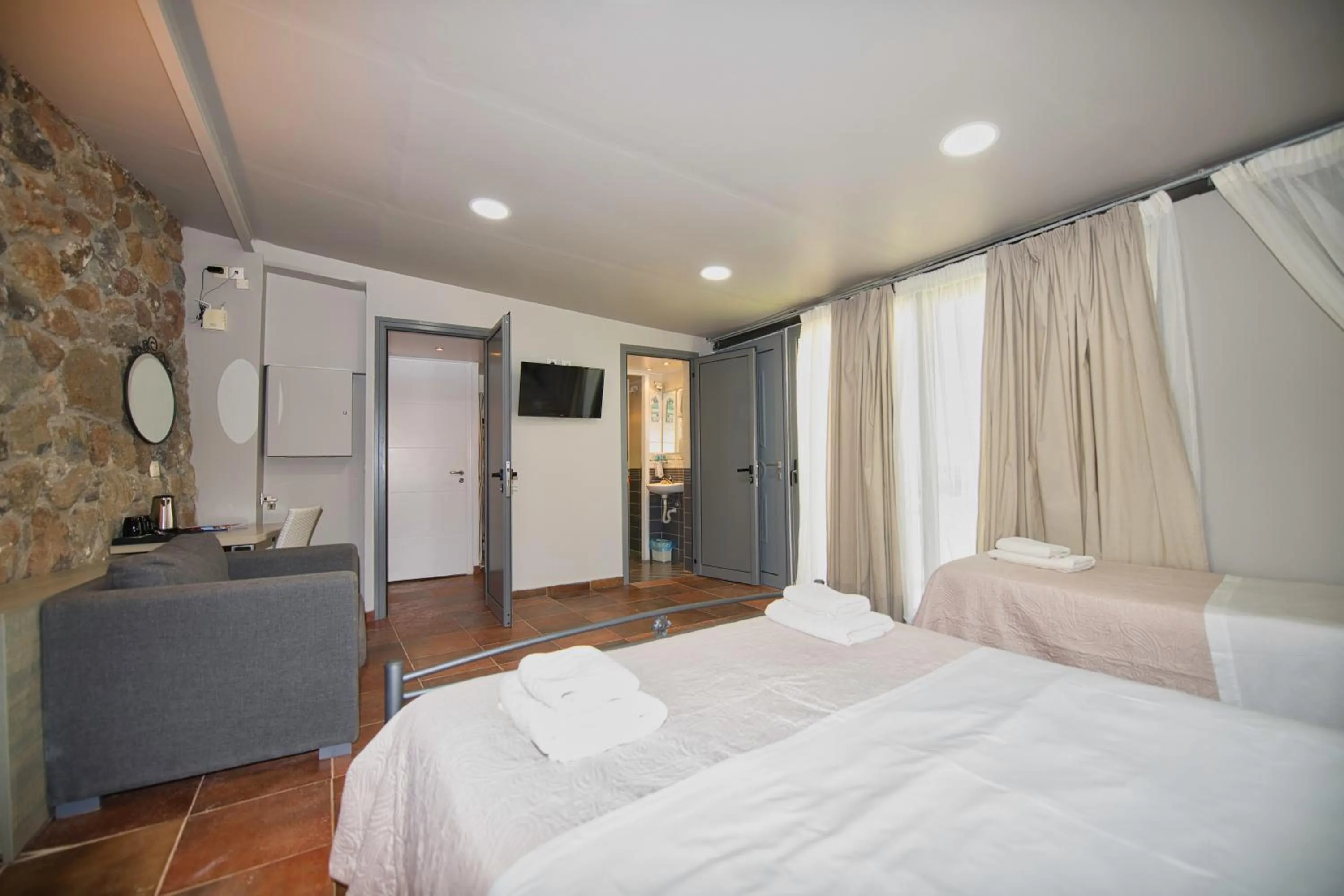 Bed in Marini Luxury Apartments and Suites