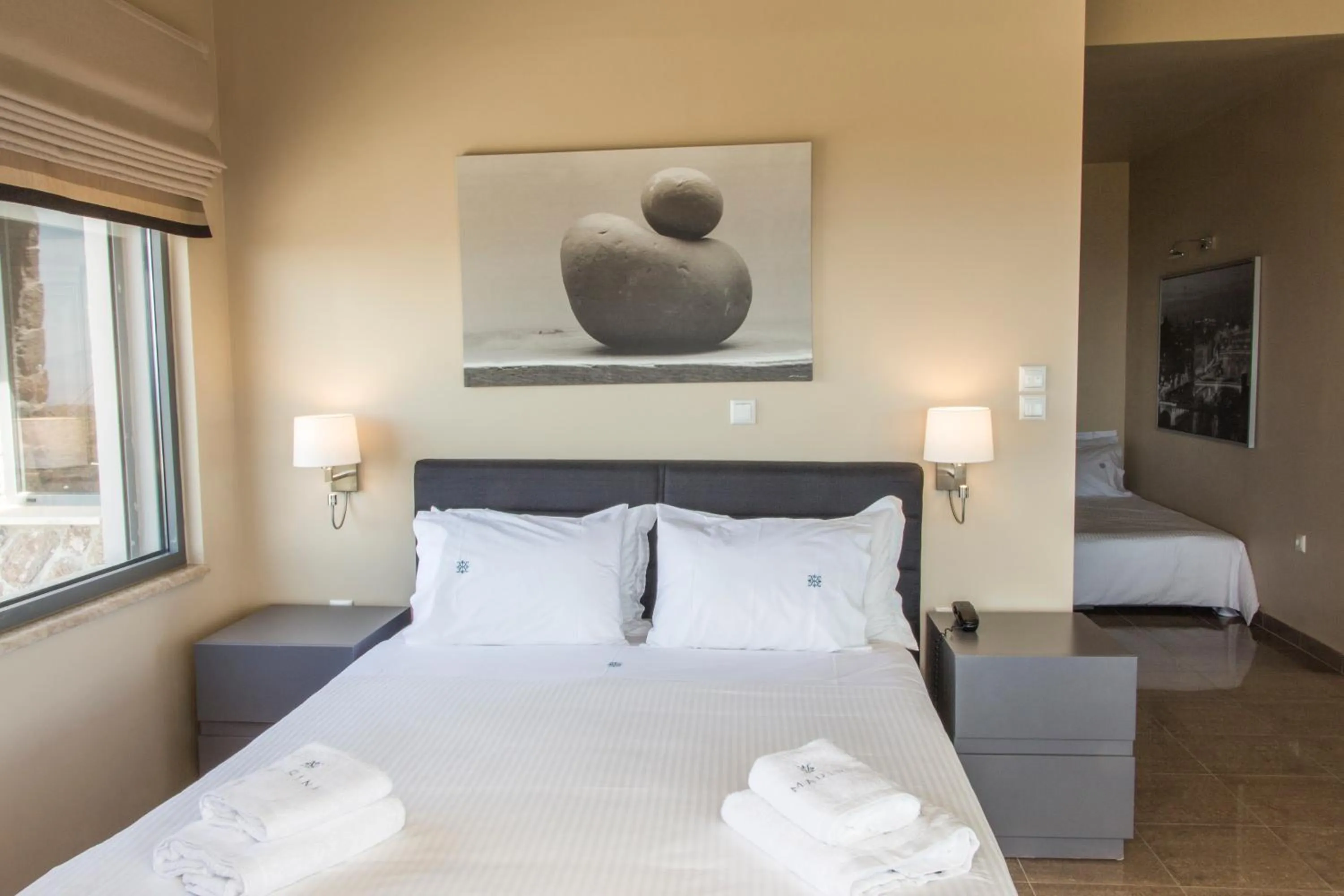 Bed in Marini Luxury Apartments and Suites
