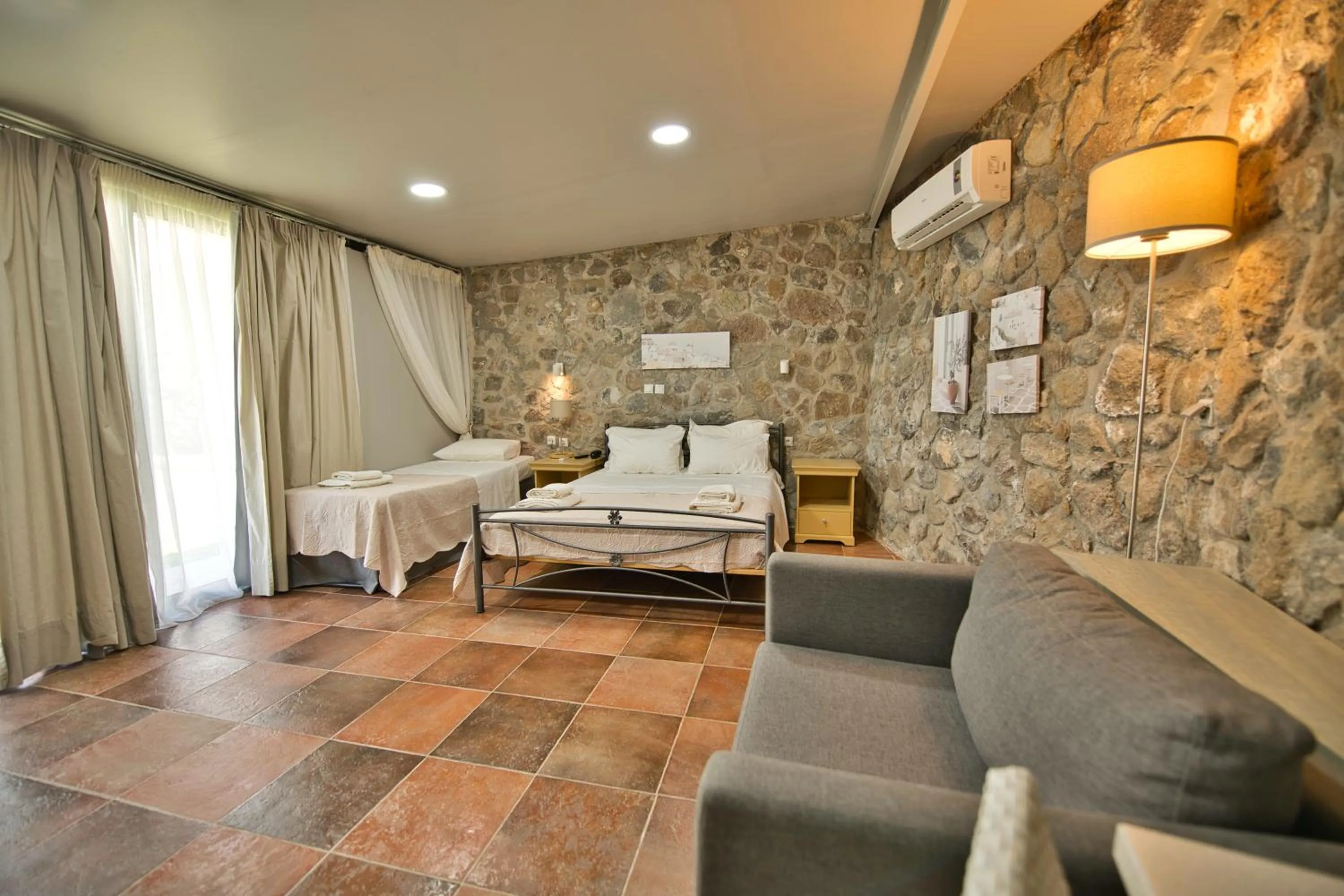 Bed in Marini Luxury Apartments and Suites