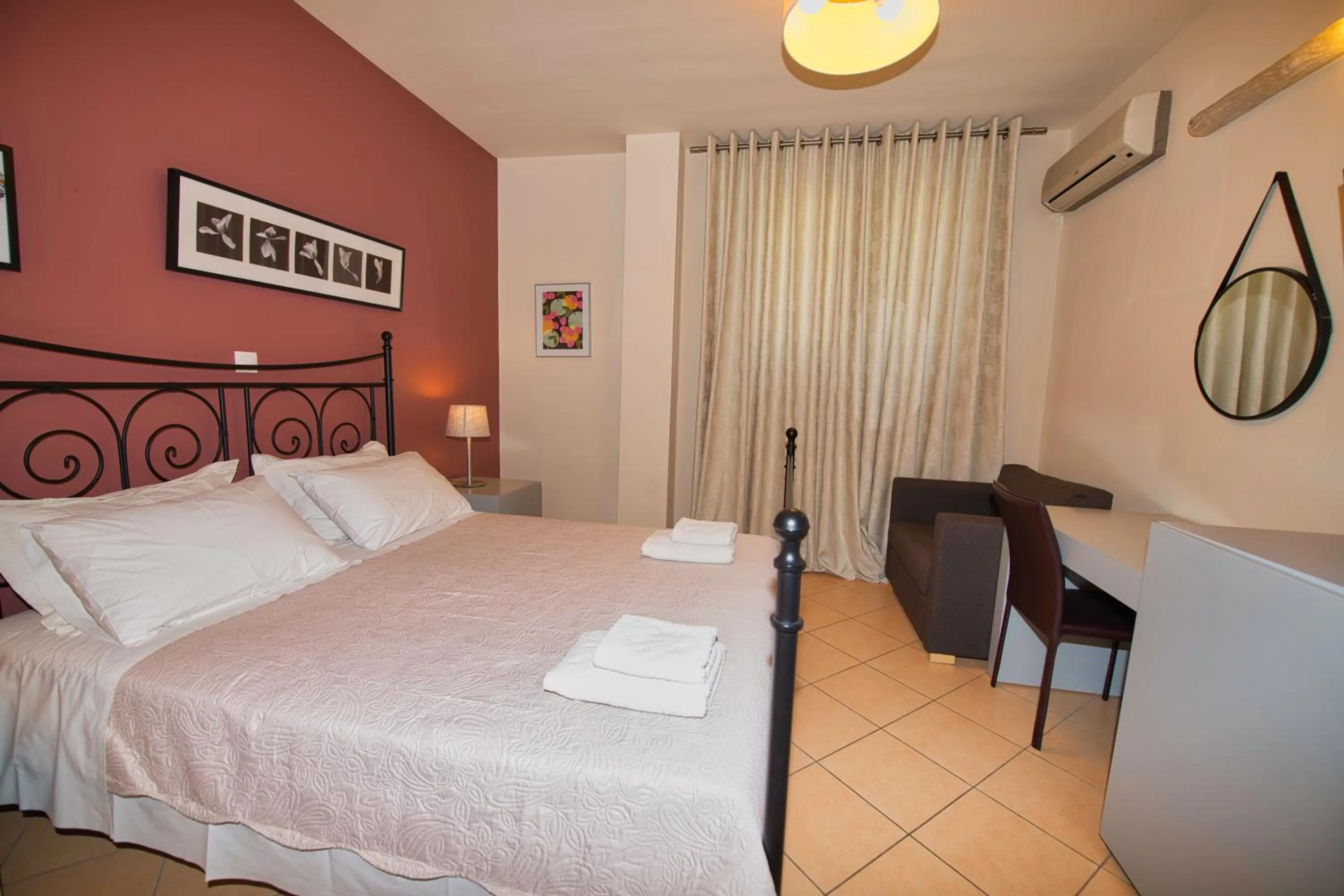 Bed in Marini Luxury Apartments and Suites