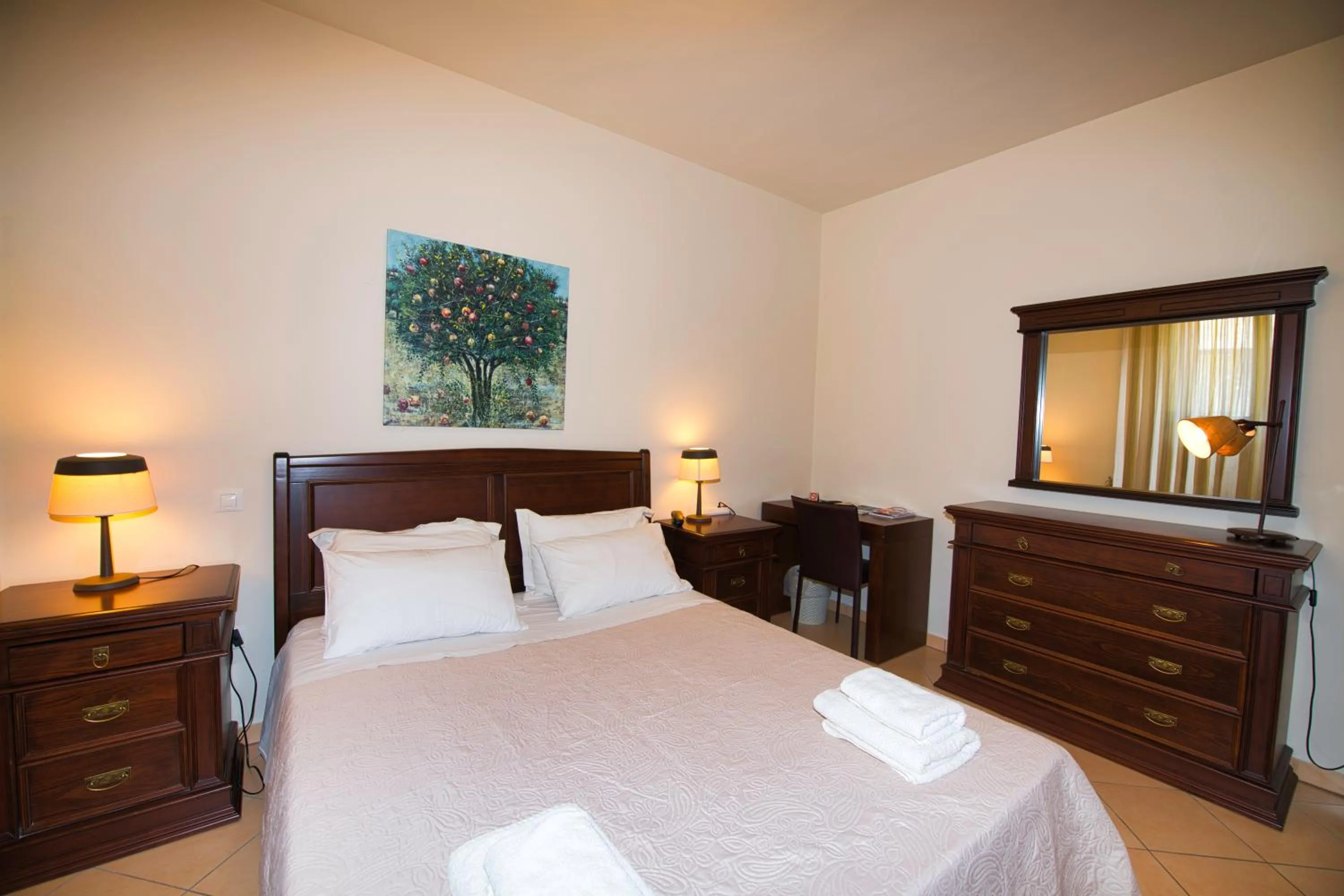 Bed in Marini Luxury Apartments and Suites