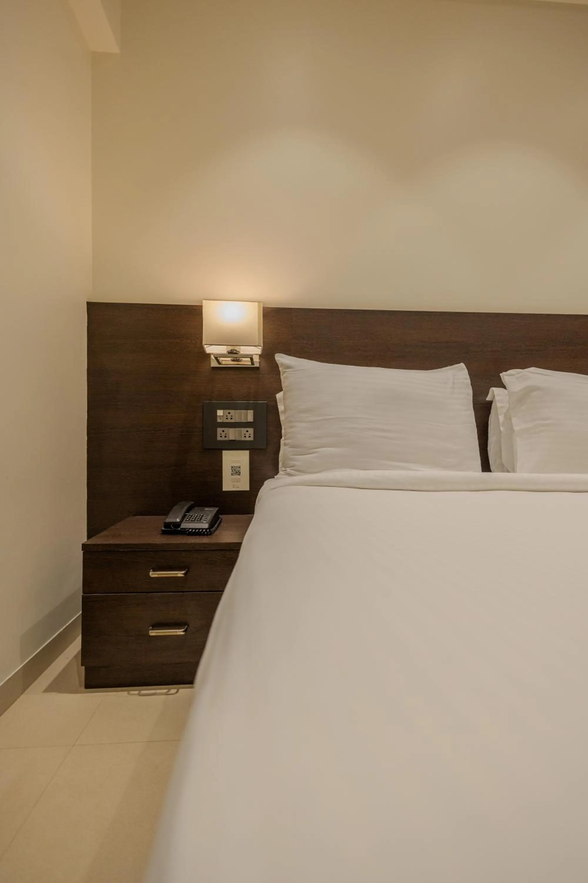 Bed in Freesia Residency by Express Inn