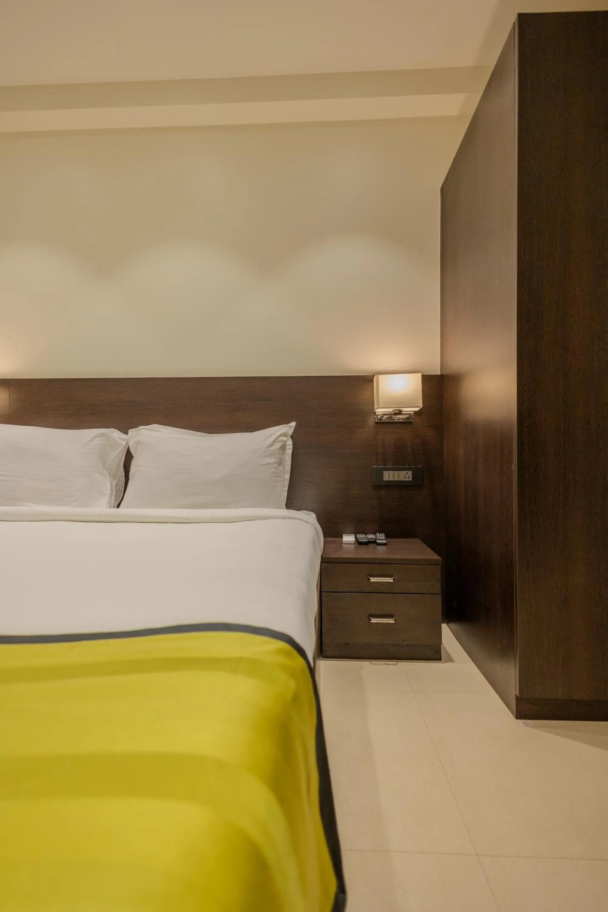 Bed in Freesia Residency by Express Inn