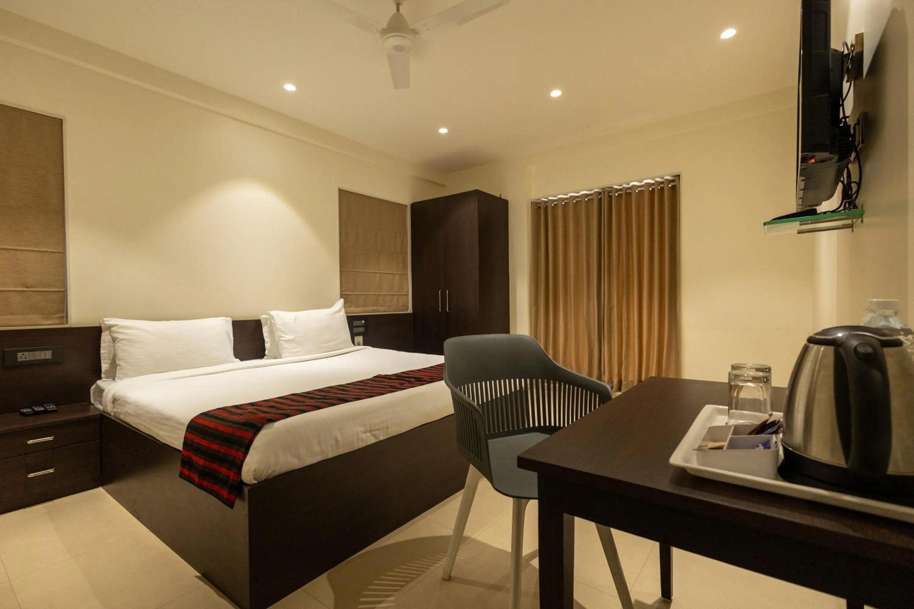 Communal lounge/ TV room, Bed in Freesia Residency by Express Inn