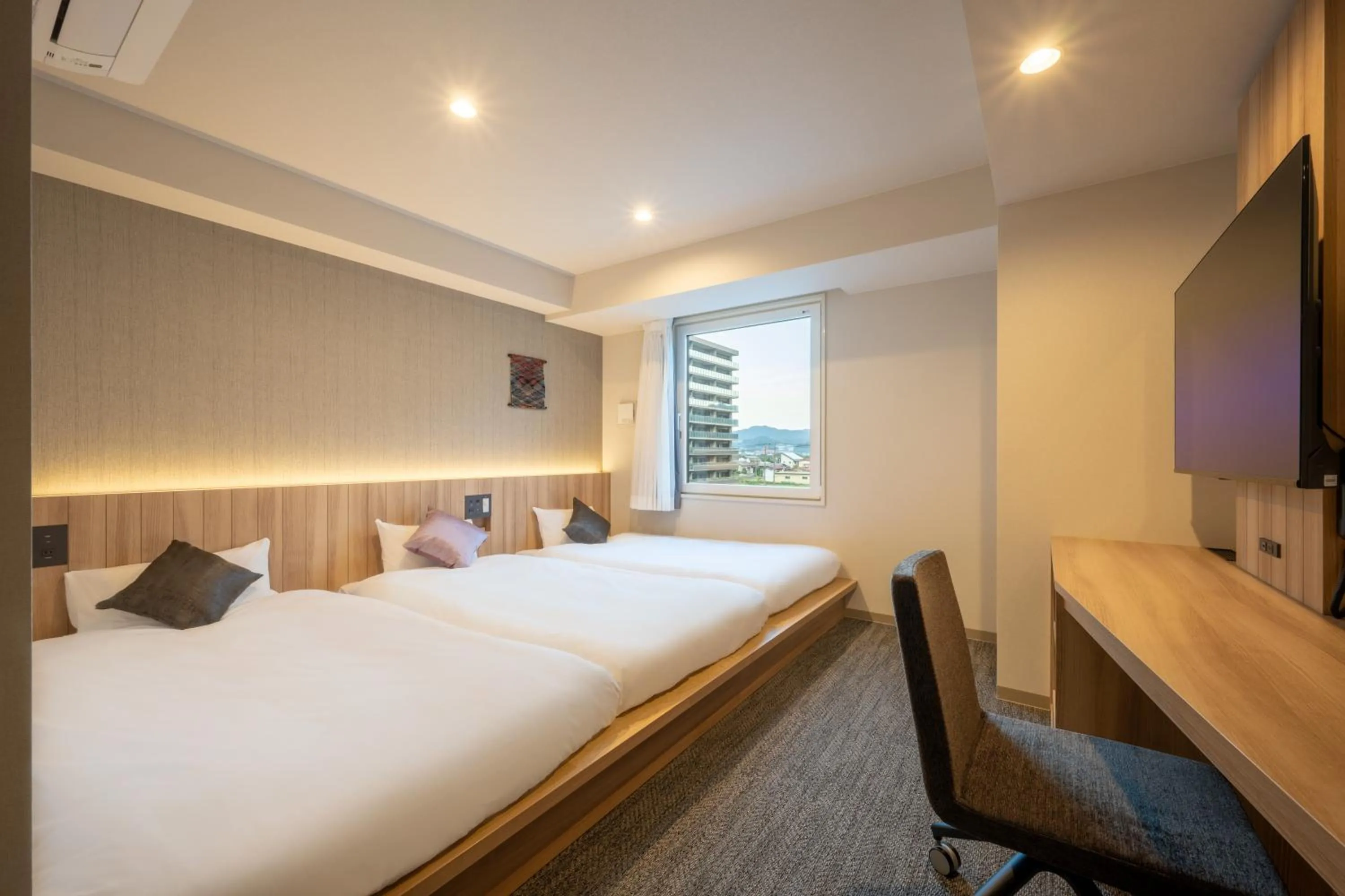 Bed in SAKURA PORT HOTEL