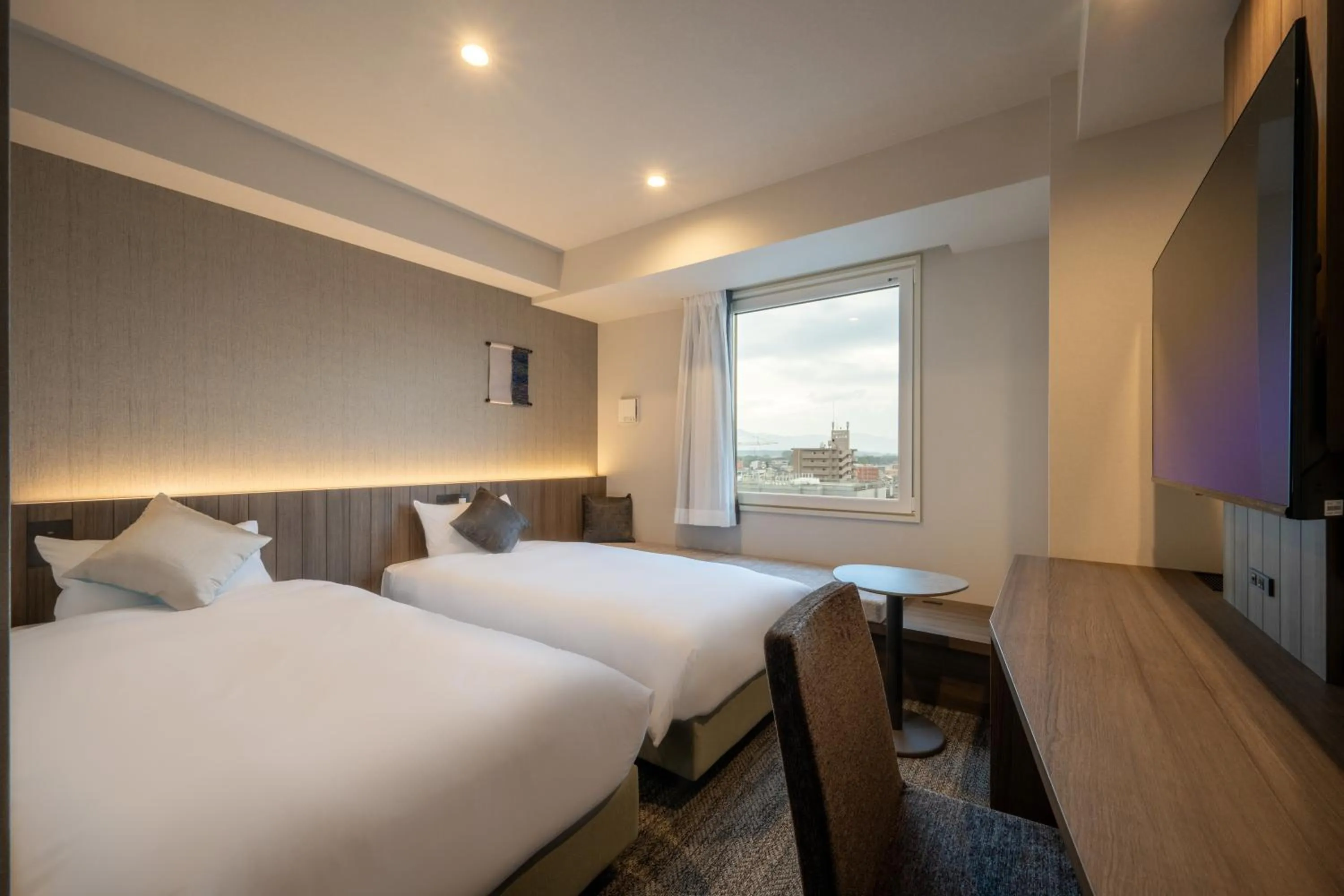 Bed in SAKURA PORT HOTEL