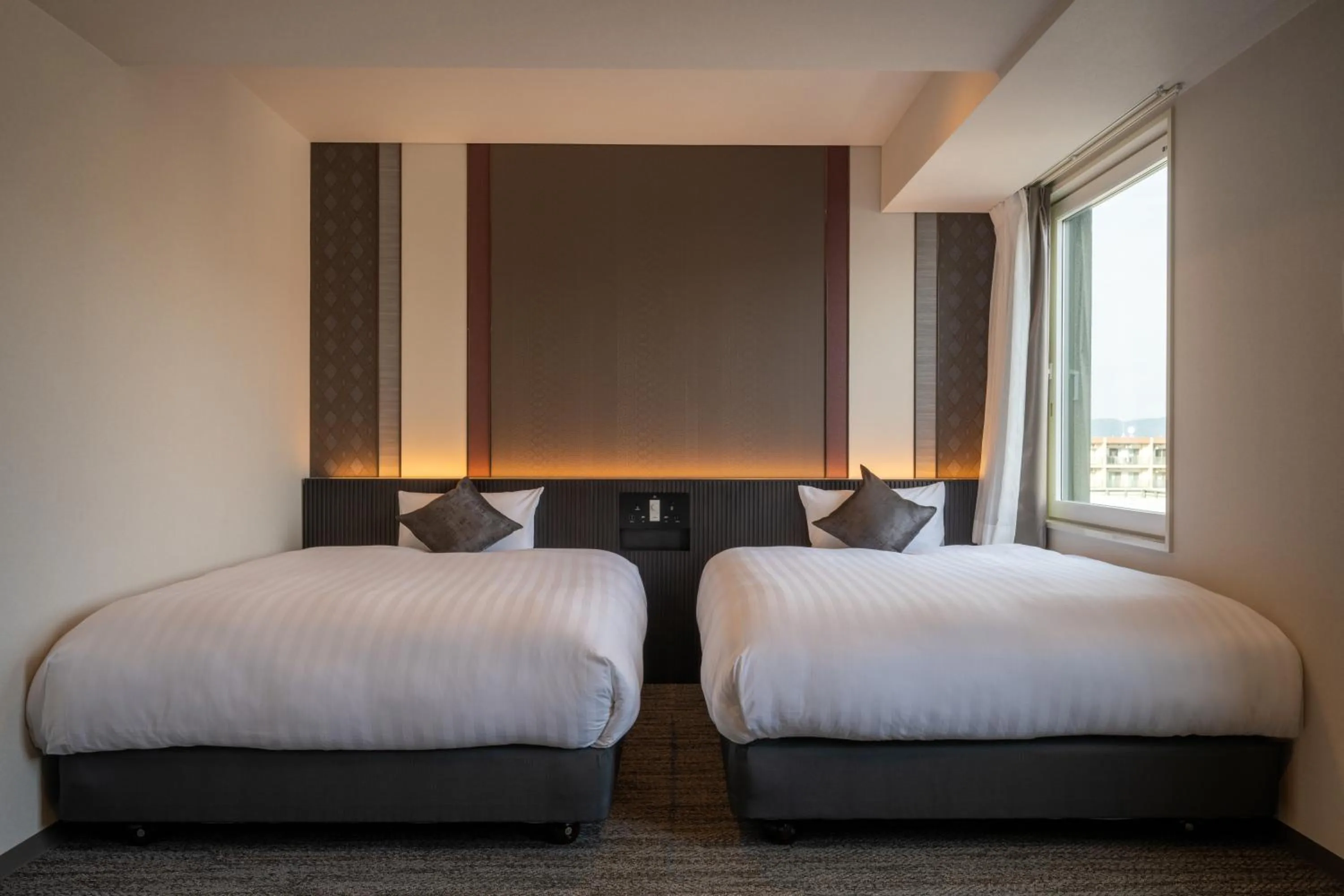 Bed in SAKURA PORT HOTEL