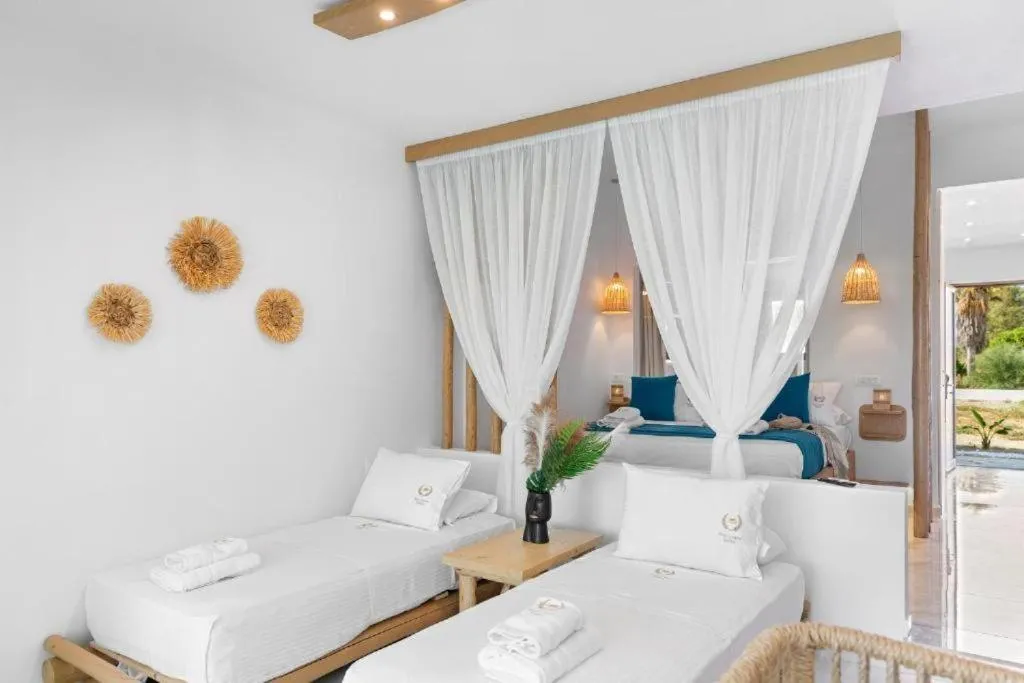 Bed in Alia Beachfront Suites and Spa
