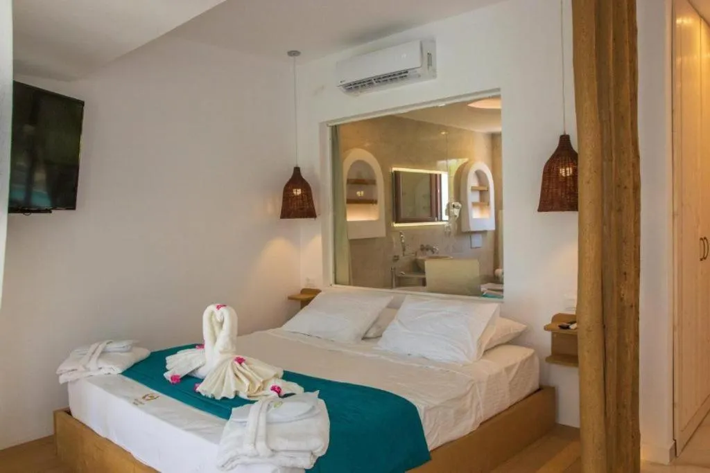 Bed in Alia Beachfront Suites and Spa