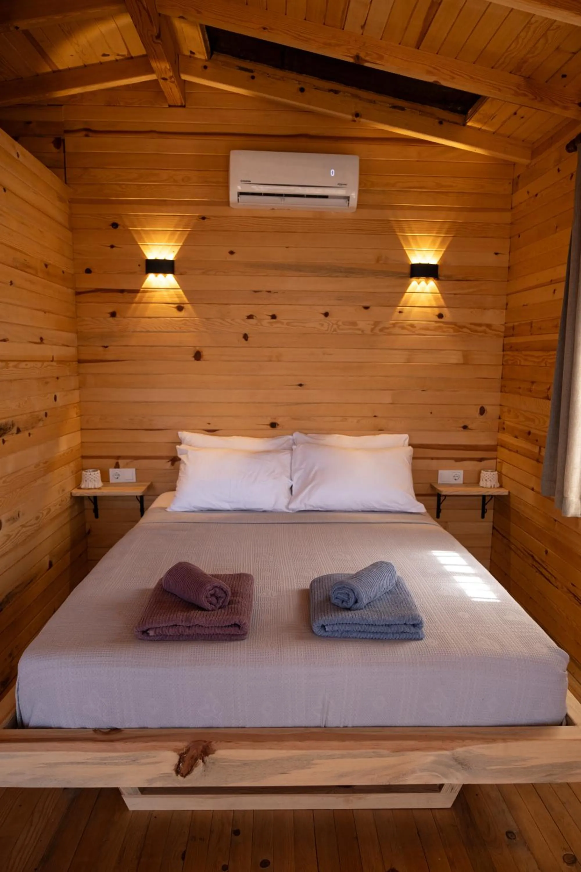 Bed in Goat Bungalow and Camping