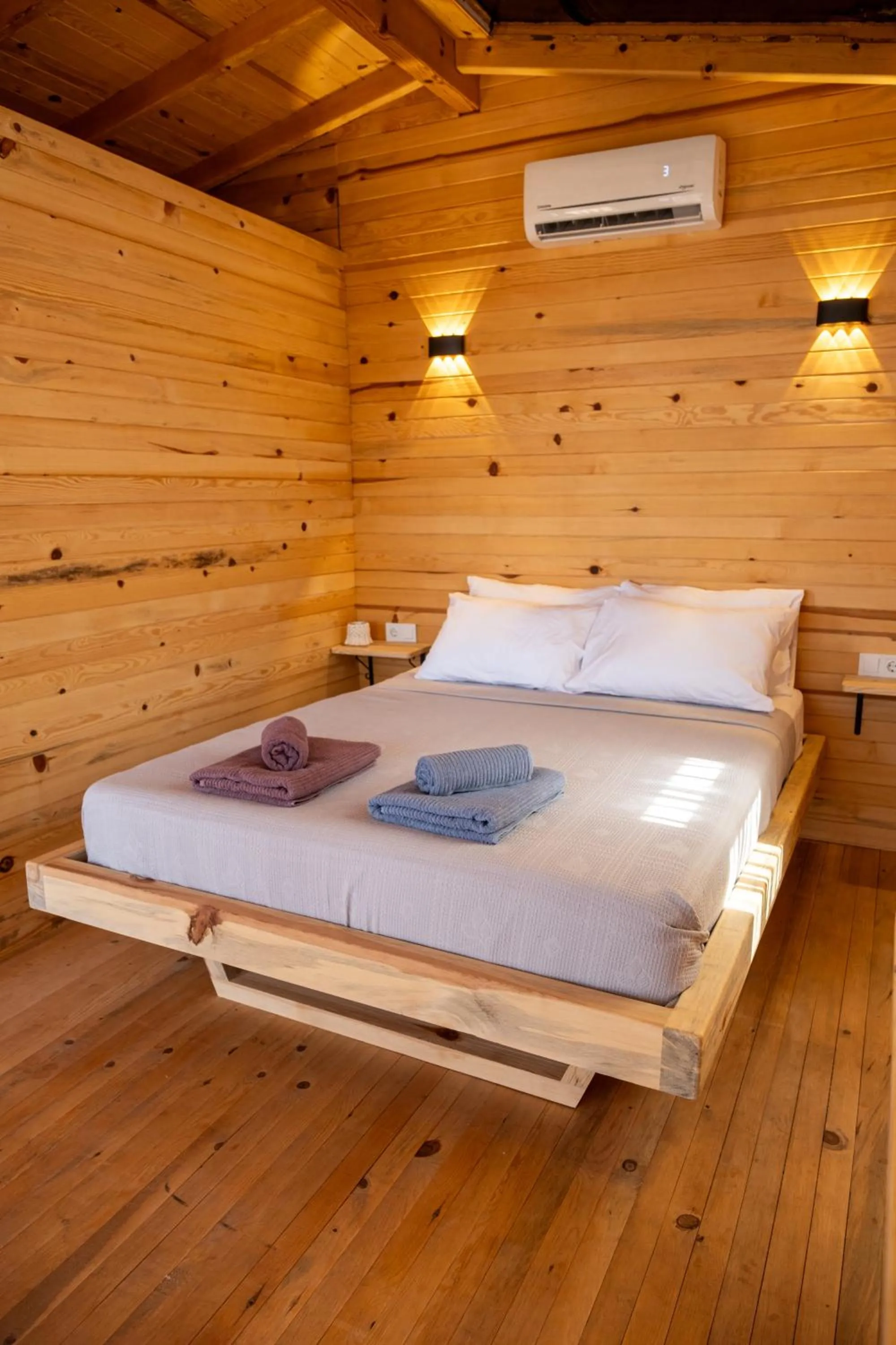 Bed in Goat Bungalow and Camping