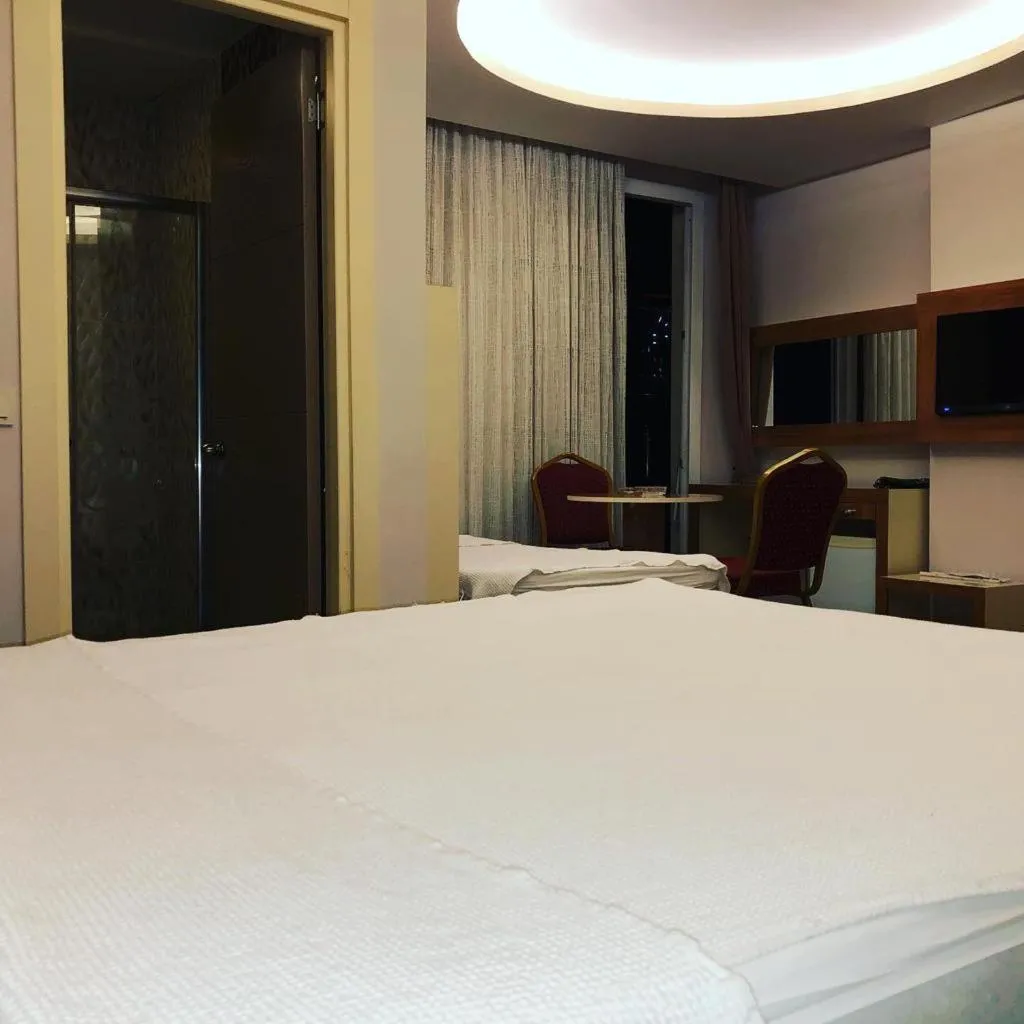 Bed in Grand Mardin Hotel