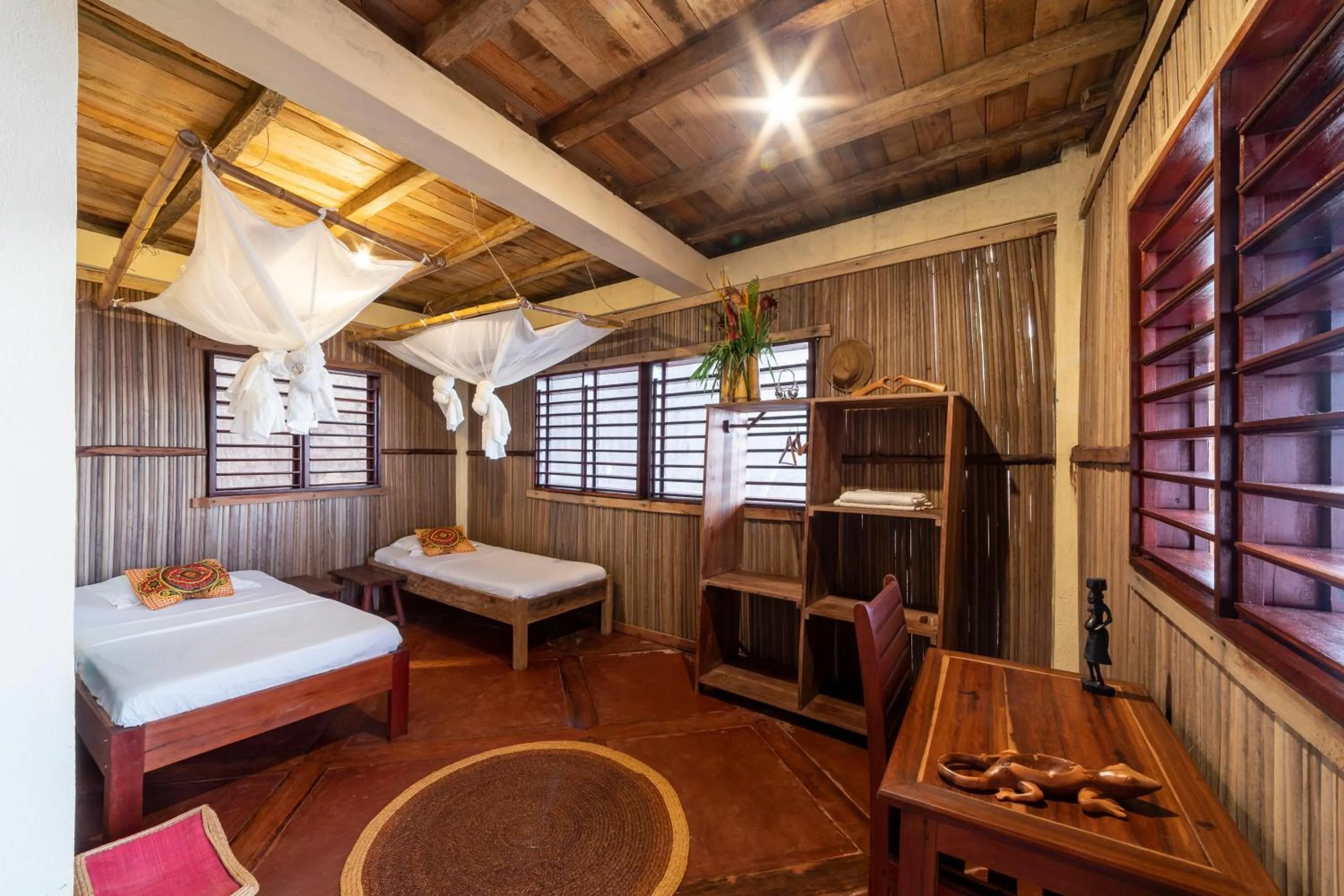 Photo of the whole room, Bed in Floraly Komba Hotel - Nosy Komba