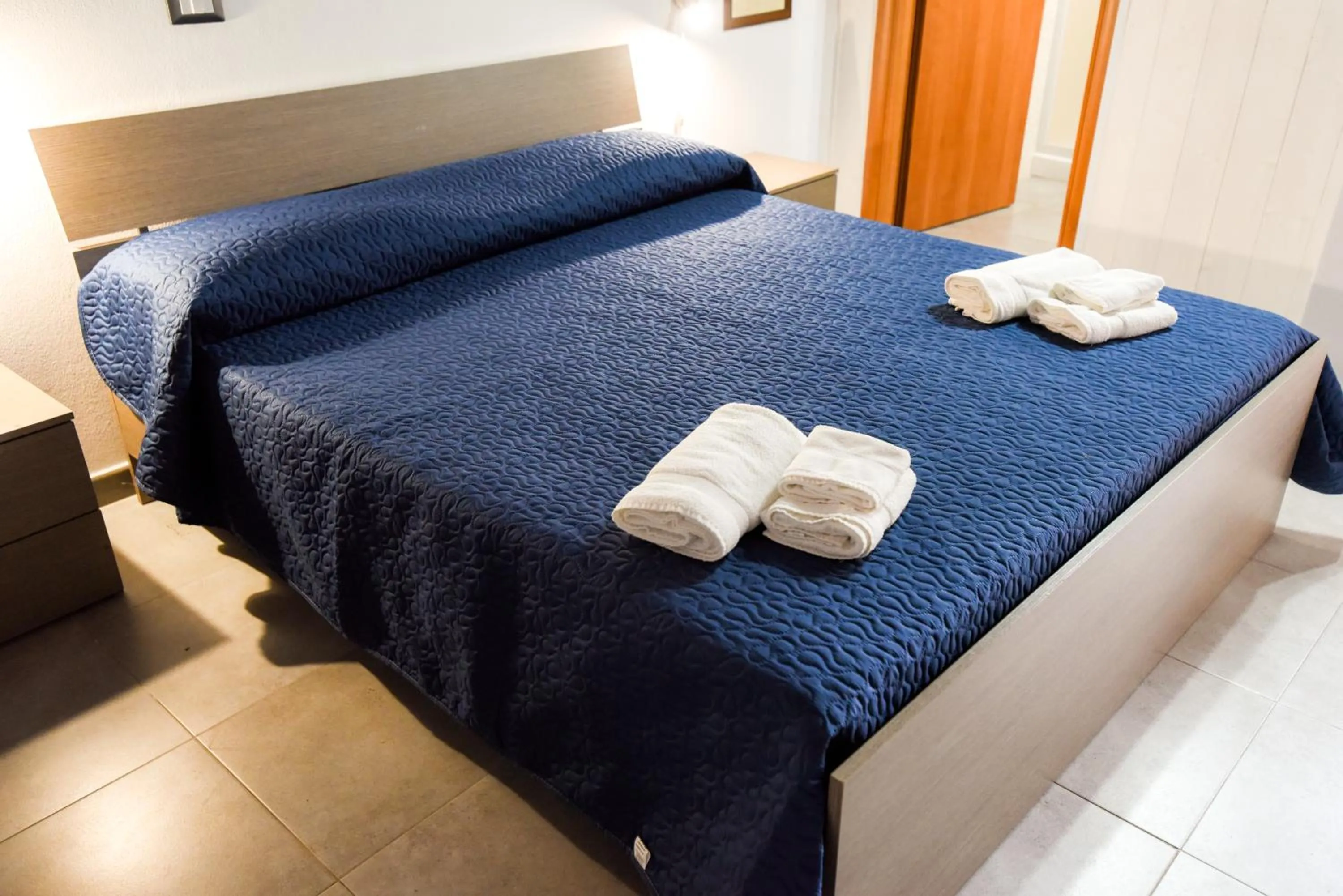 Bed in Giardini Sausari Residence