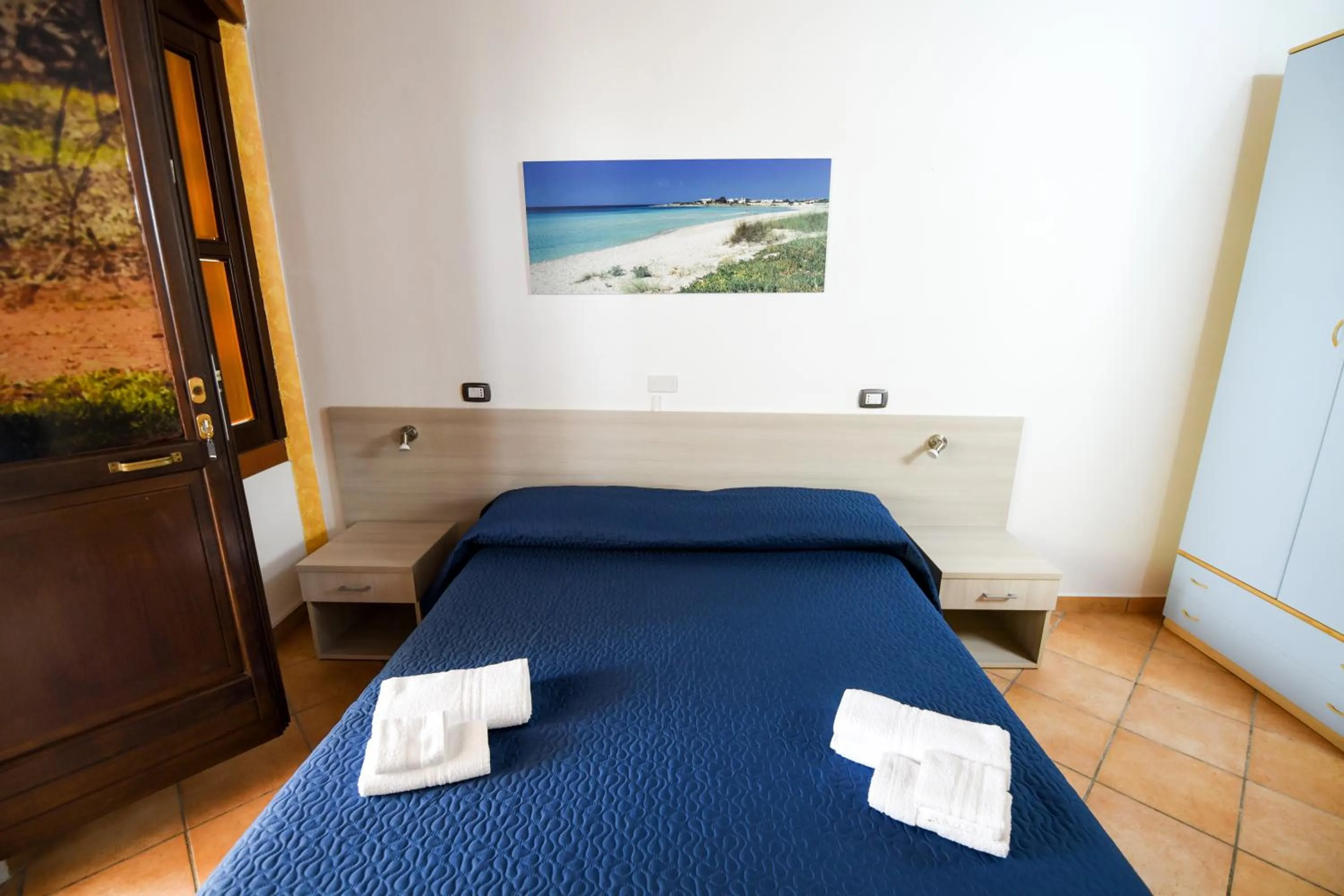 Bed in Giardini Sausari Residence