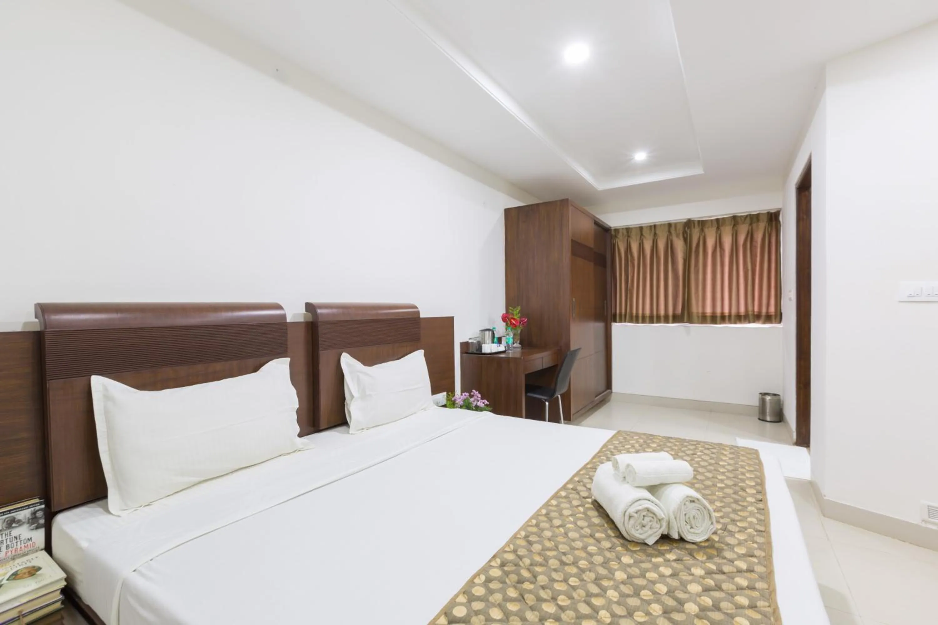 Photo of the whole room, Bed in Sanctum Suites BEL Road Bangalore