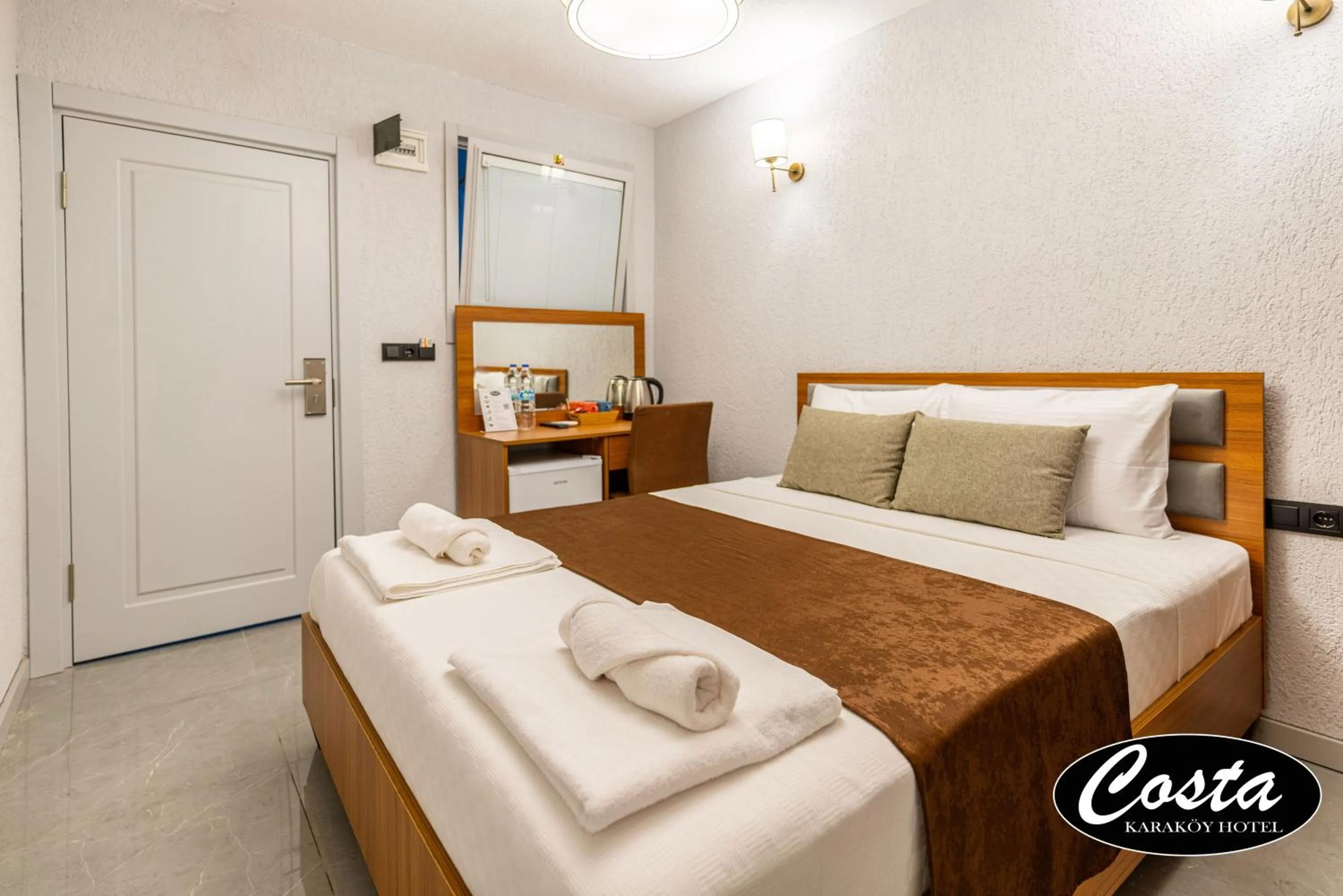 Bed in Costa Karakoy Hotel