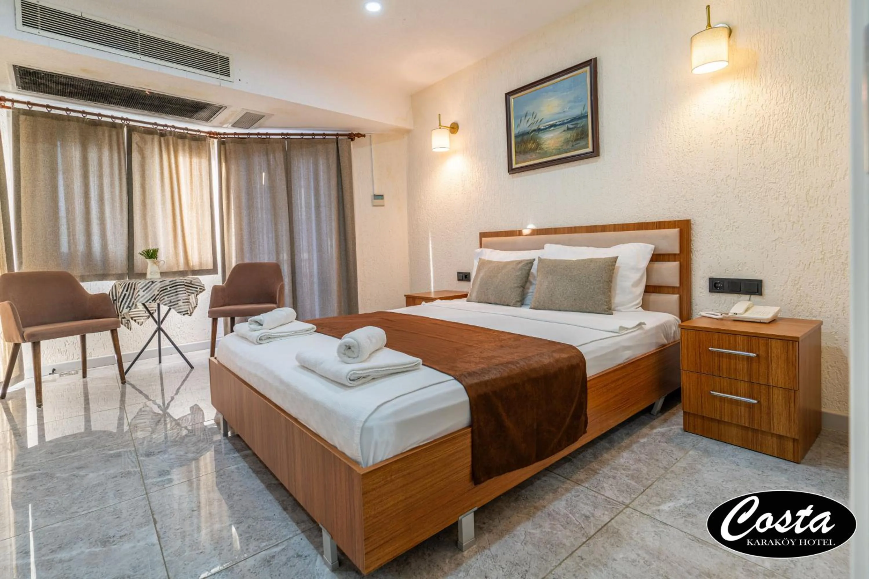 Bed in Costa Karakoy Hotel