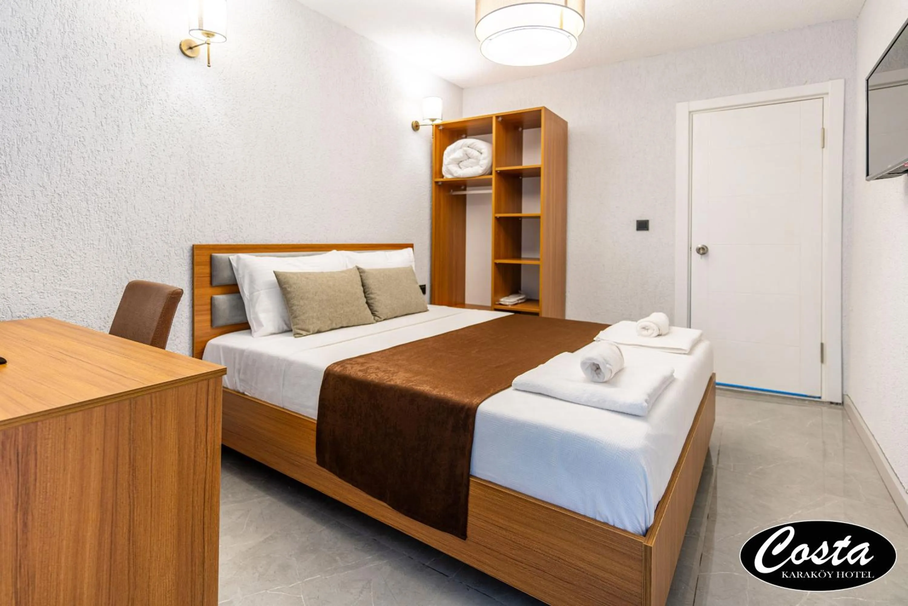 Bed in Costa Karakoy Hotel