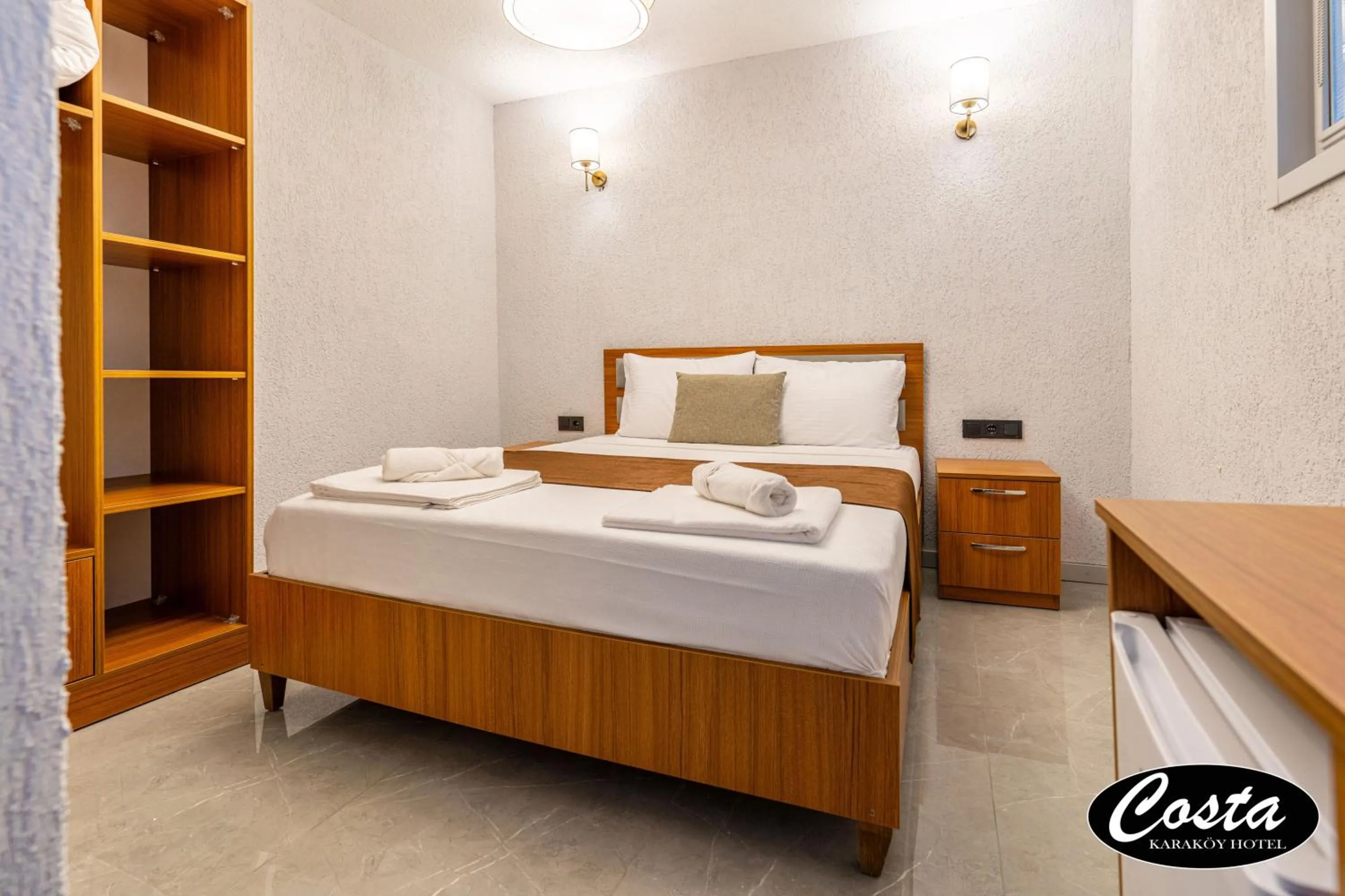 Bed in Costa Karakoy Hotel