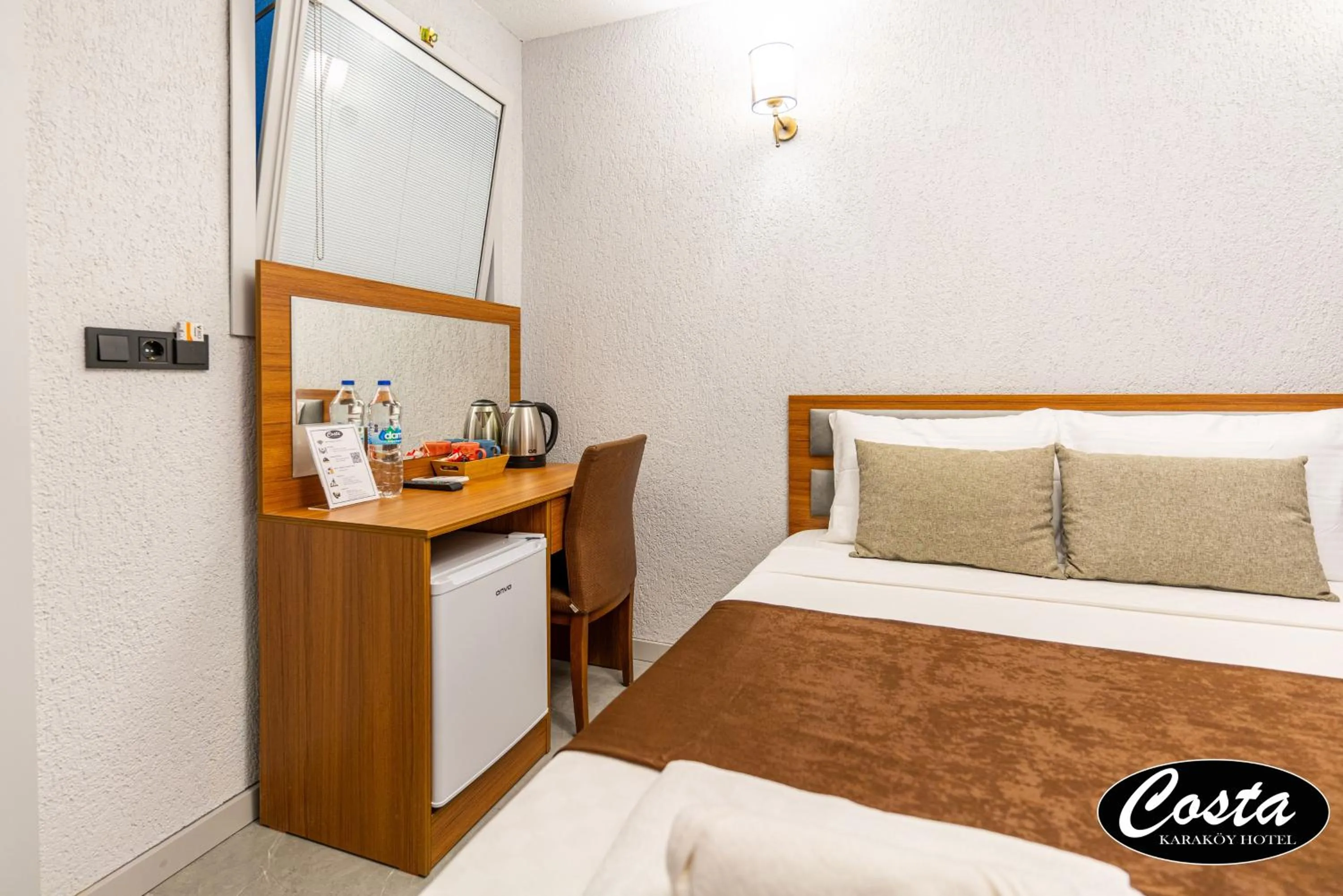 Bed in Costa Karakoy Hotel