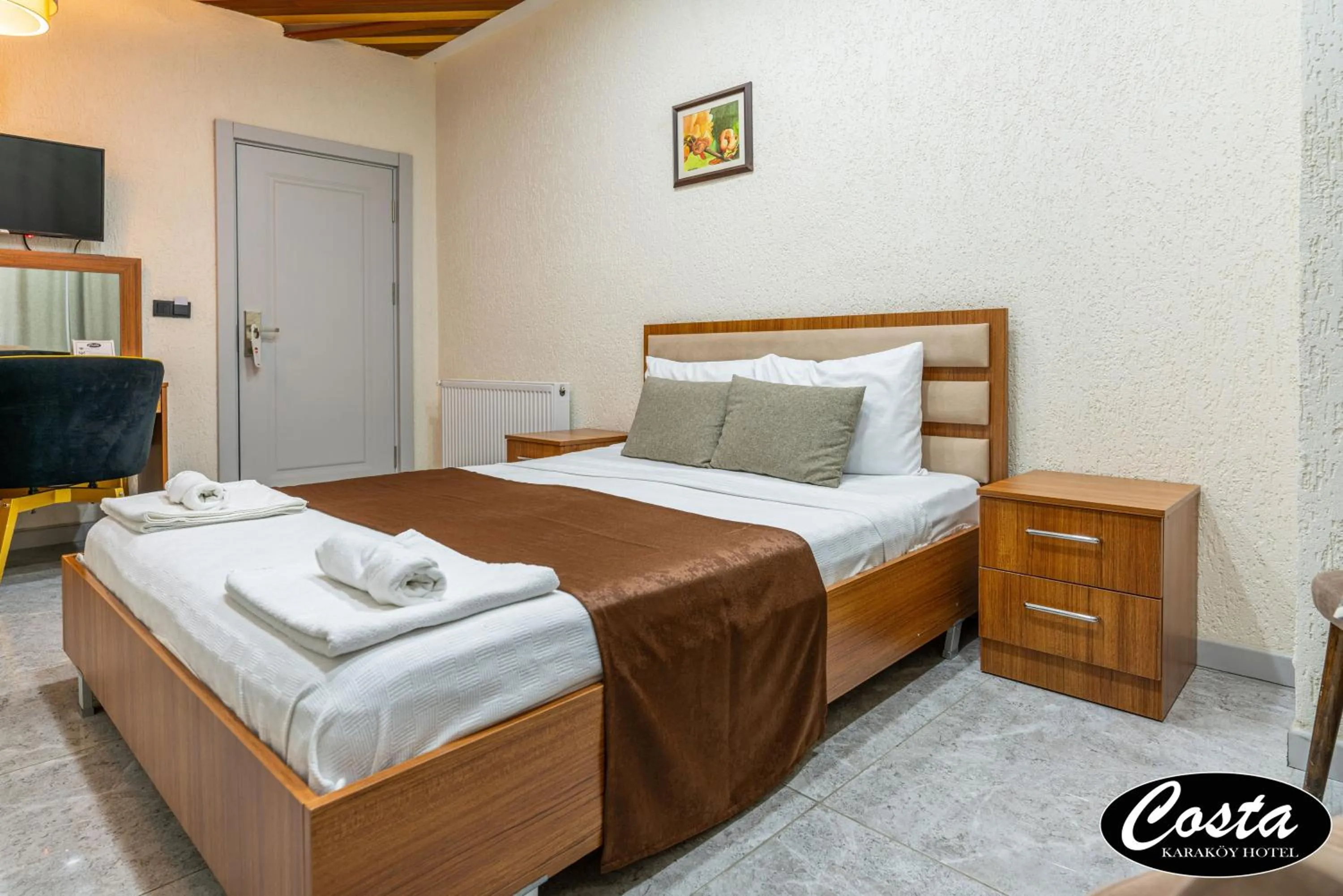 Bed in Costa Karakoy Hotel