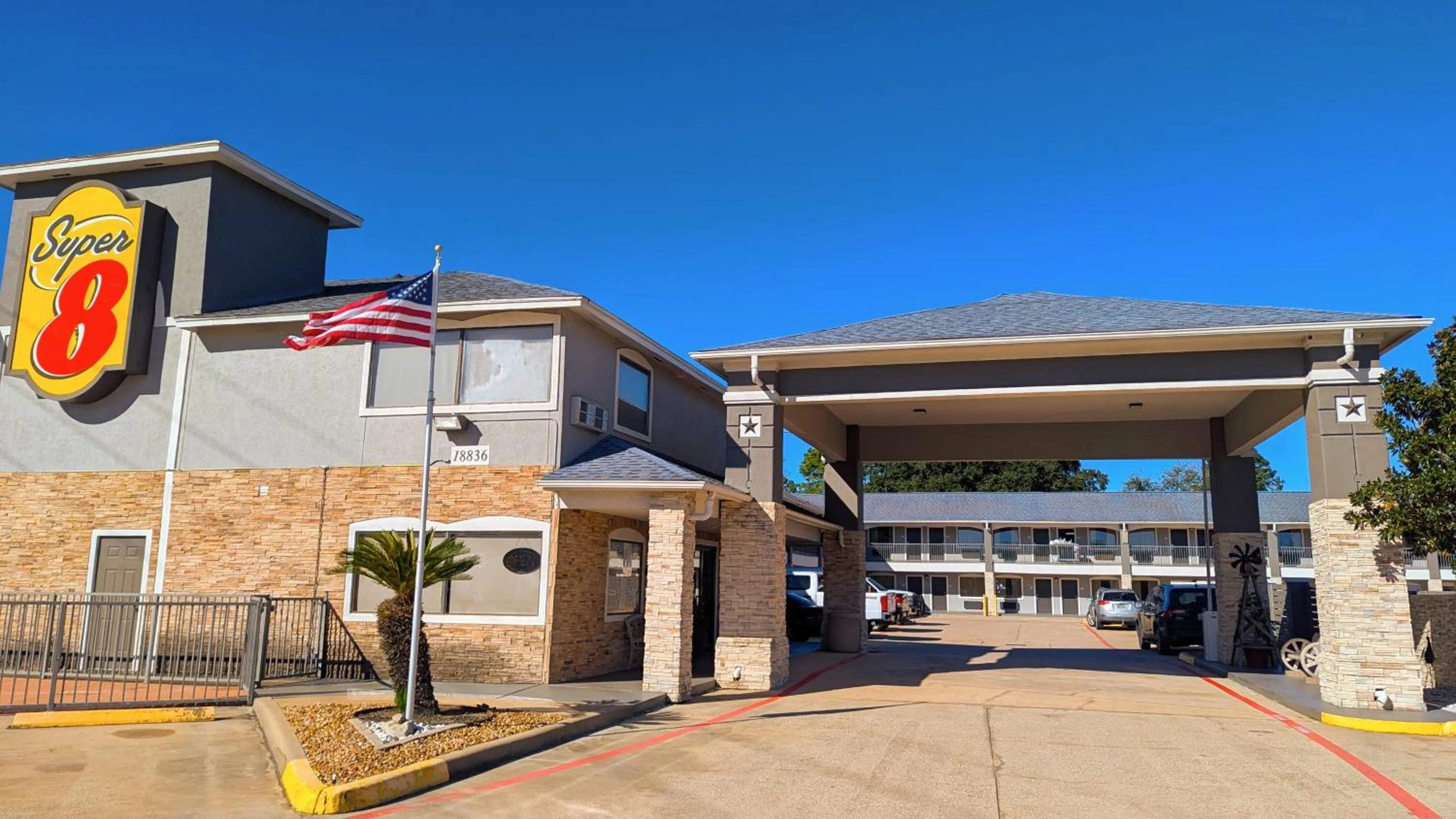 Property building in Super 8 by Wyndham Willowbrook Houston