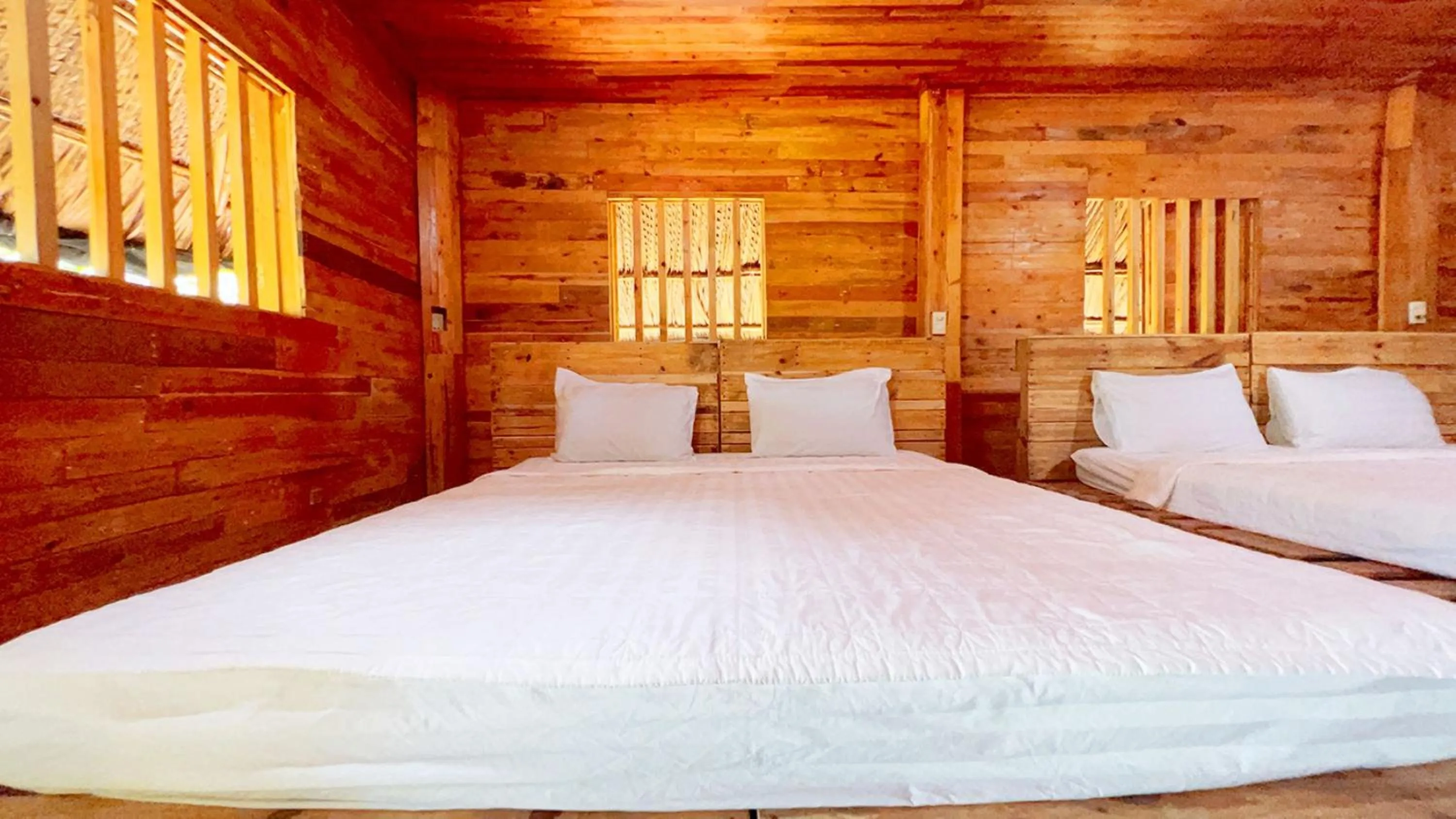 Bed in Me bungalow beach resort