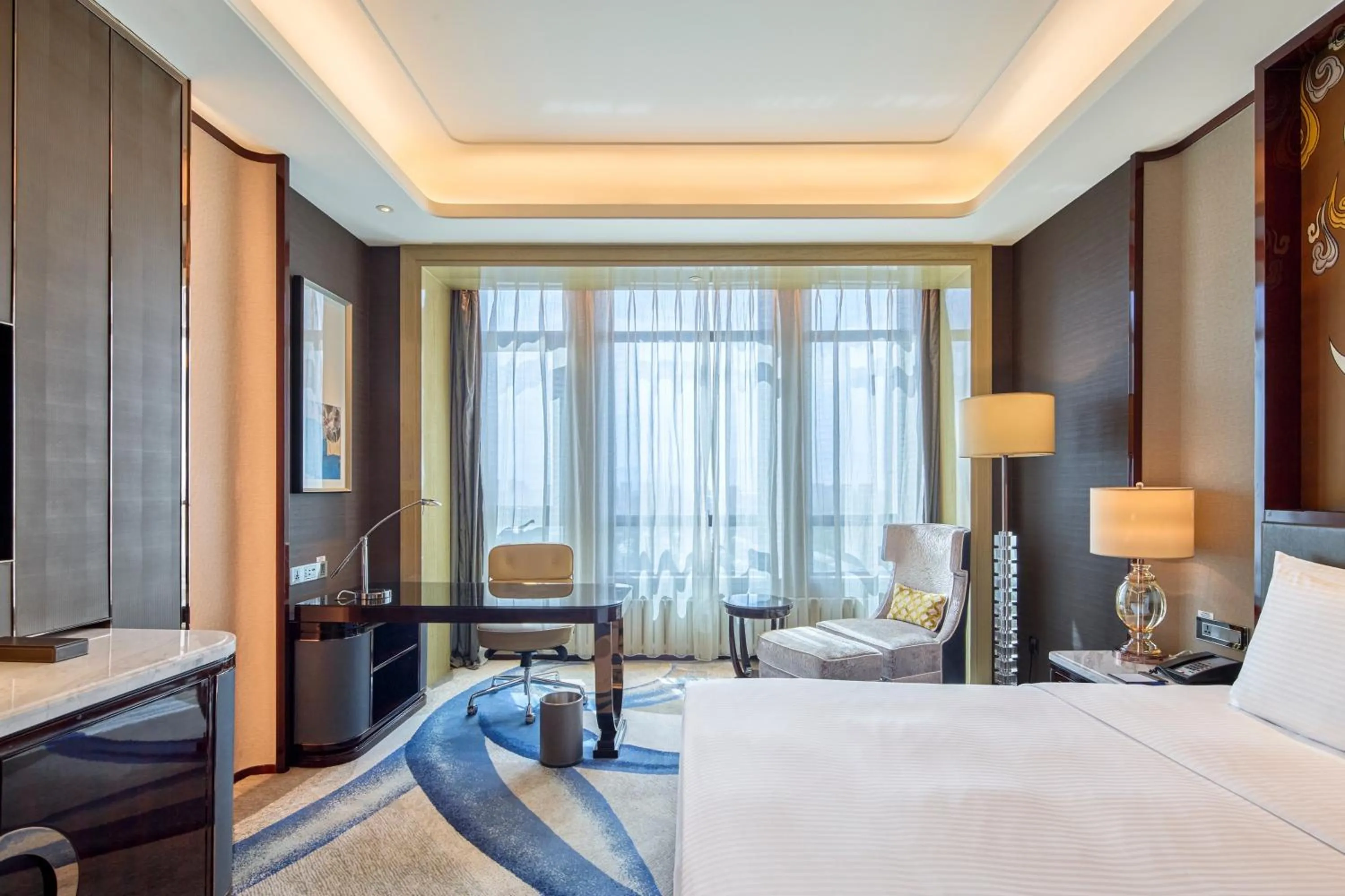 Seating area, Bed in Wanda Realm Yinchuan