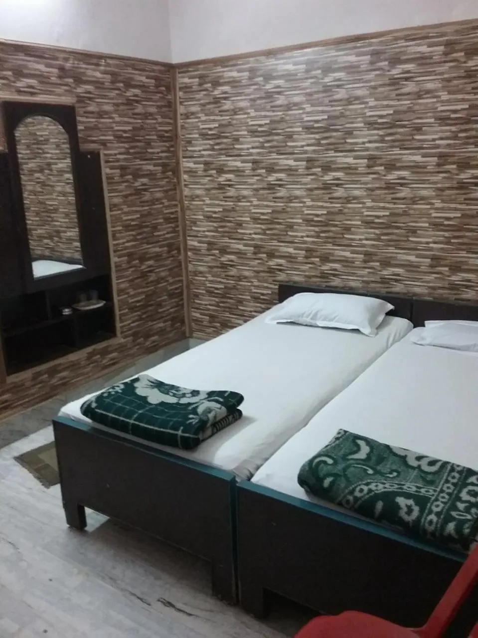 Bed in Teerth Guest House
