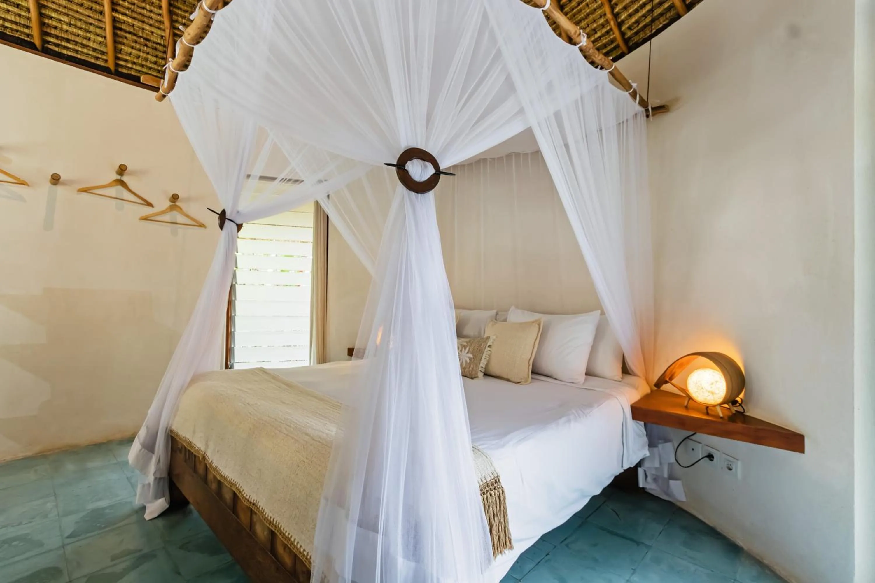 Bed in Acacia Bungalows Bingin